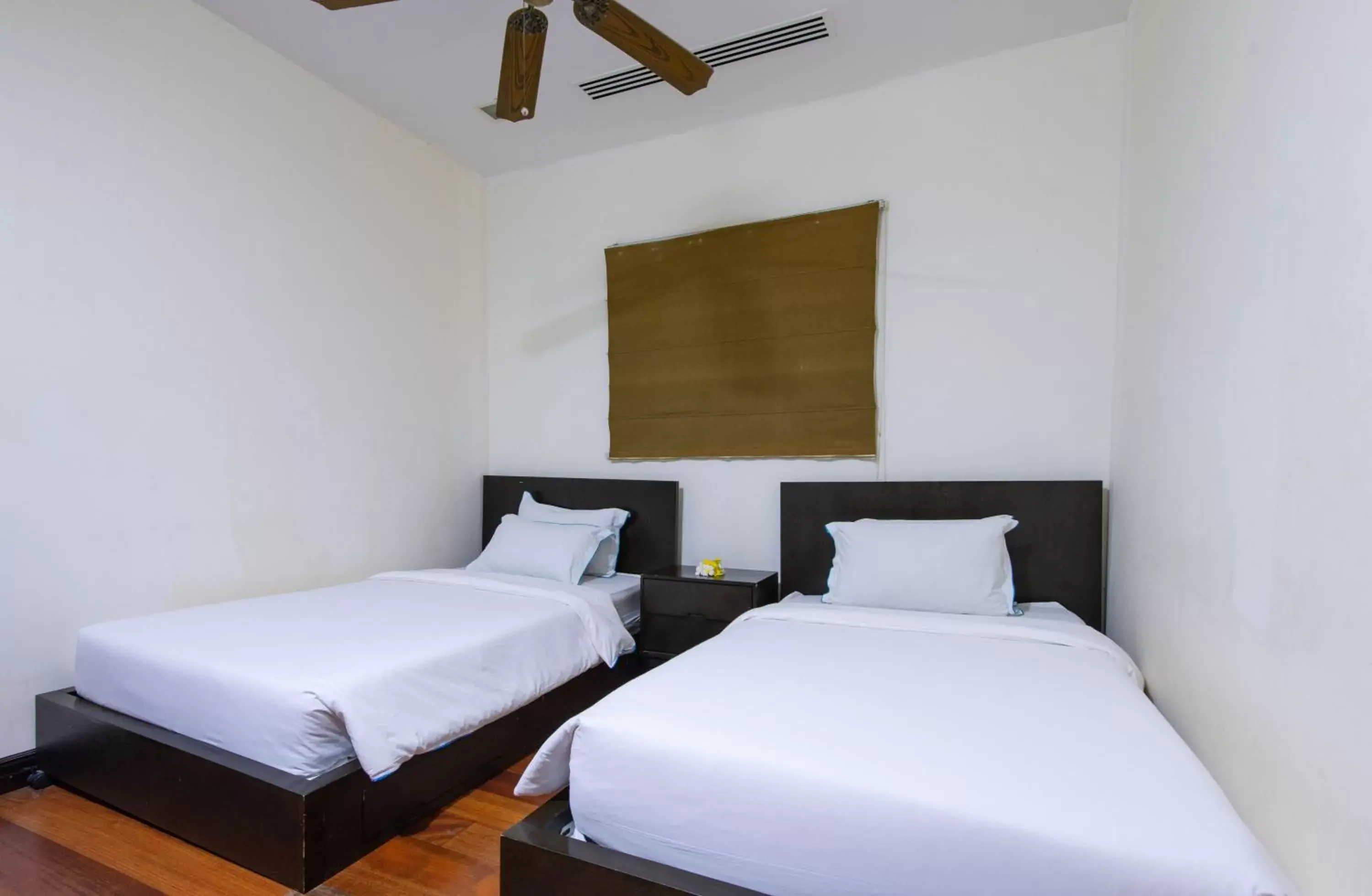 Bed in Sabah Beach Villas & Suites