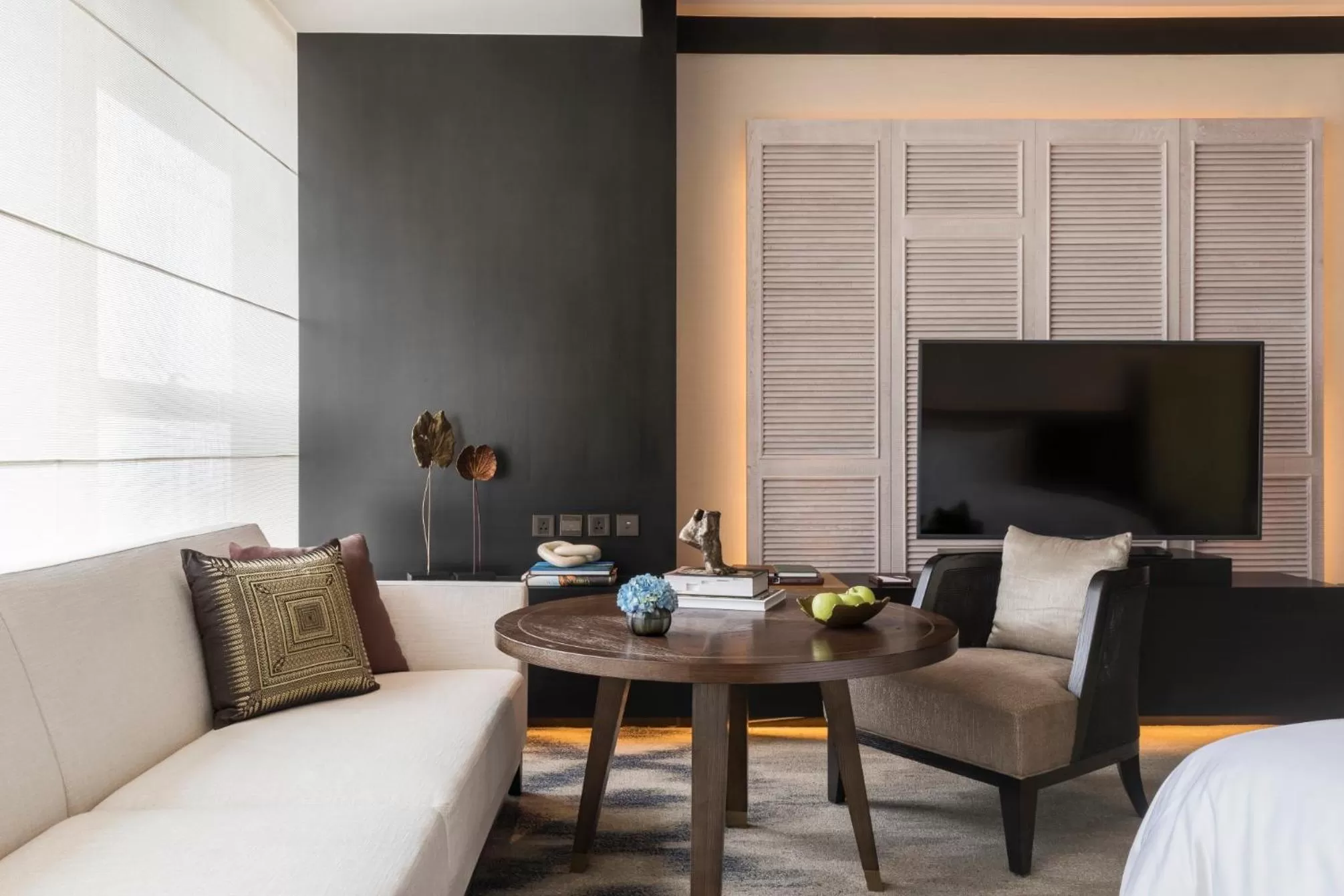 Seating area, Bed in Rosewood Phnom Penh