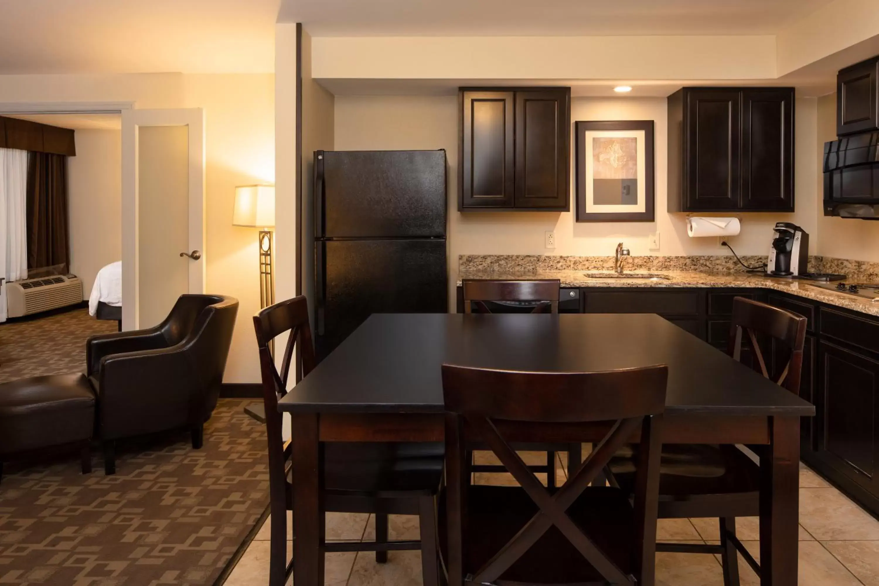 Photo of the whole room, Kitchen/Kitchenette in Holiday Inn and Suites Charleston West, an IHG Hotel