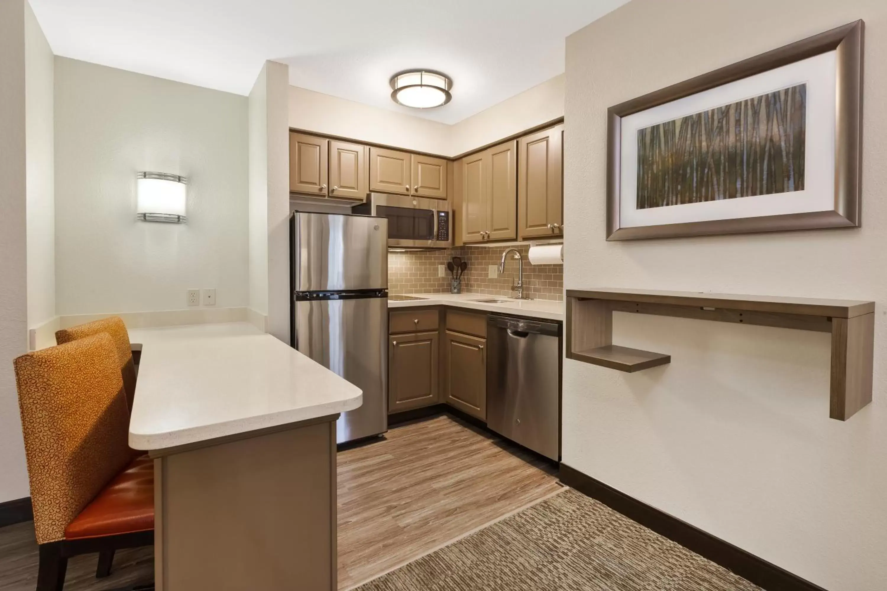 Kitchen or kitchenette, Kitchen/Kitchenette in Staybridge Suites Kalamazoo, an IHG Hotel