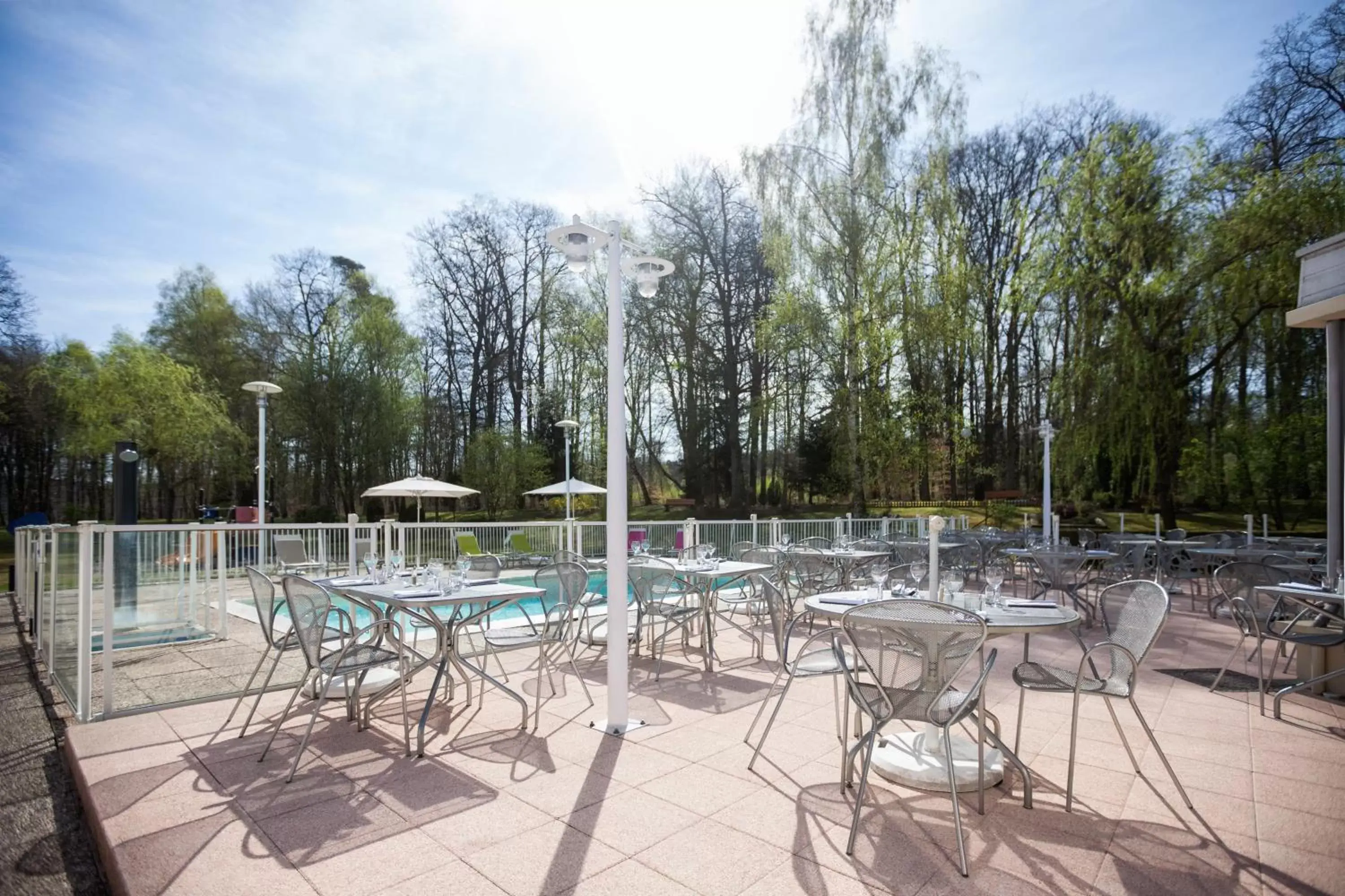 Patio, Swimming Pool in Novotel Mulhouse Bâle Fribourg