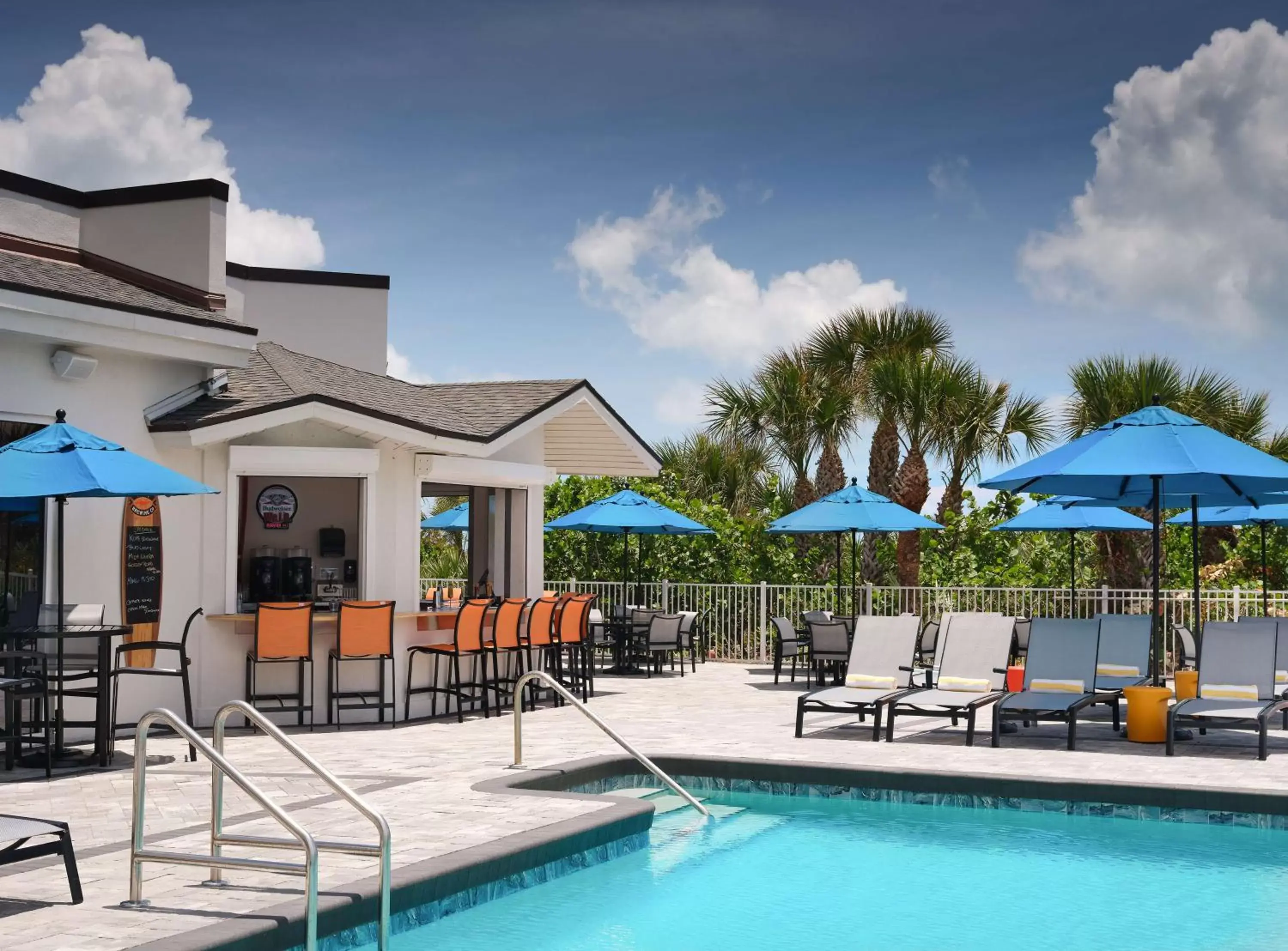 Lounge or bar, Swimming Pool in Hilton Garden Inn Cocoa Beach-Oceanfront, FL