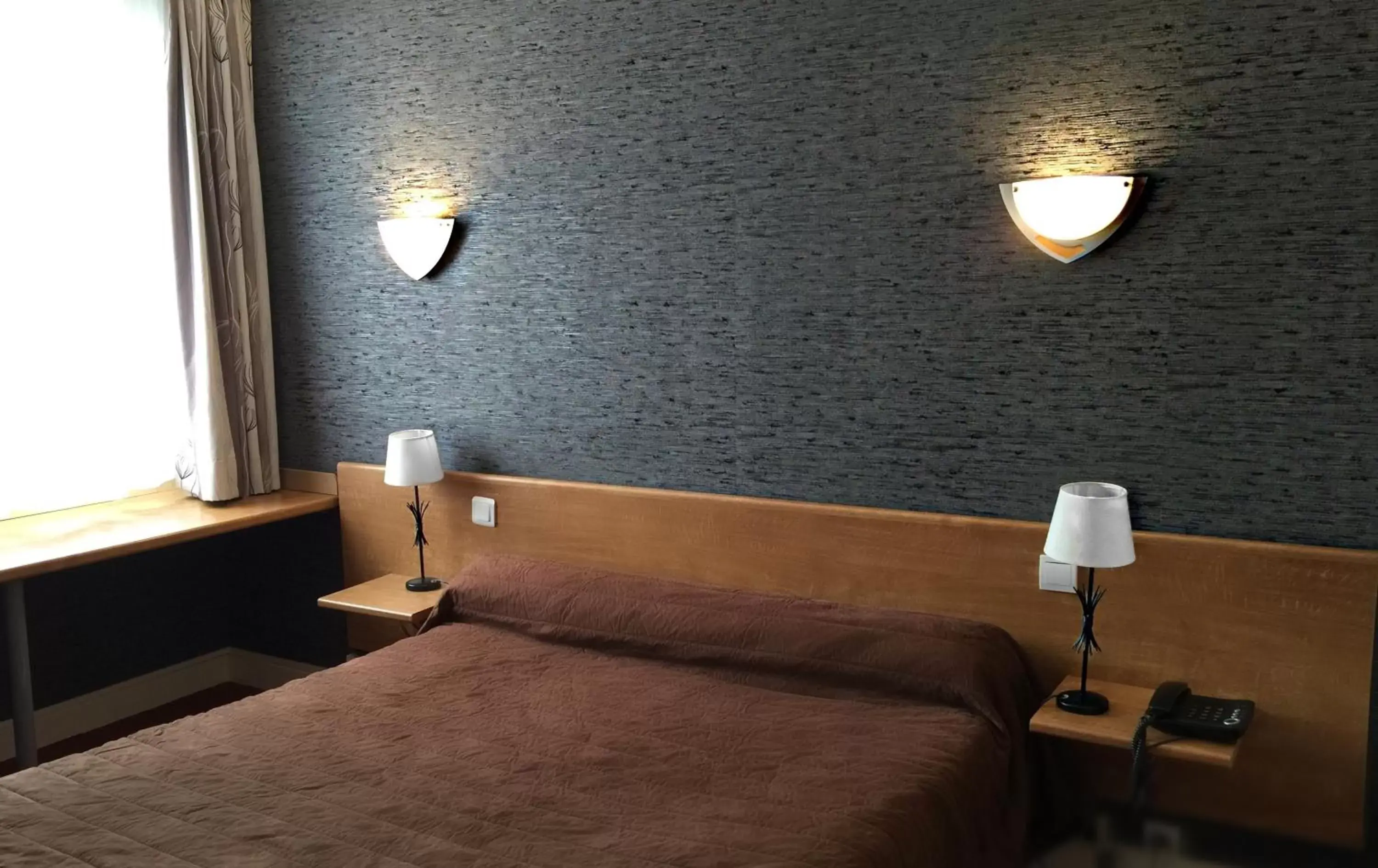 Bed in Hotel Saint-Aignan