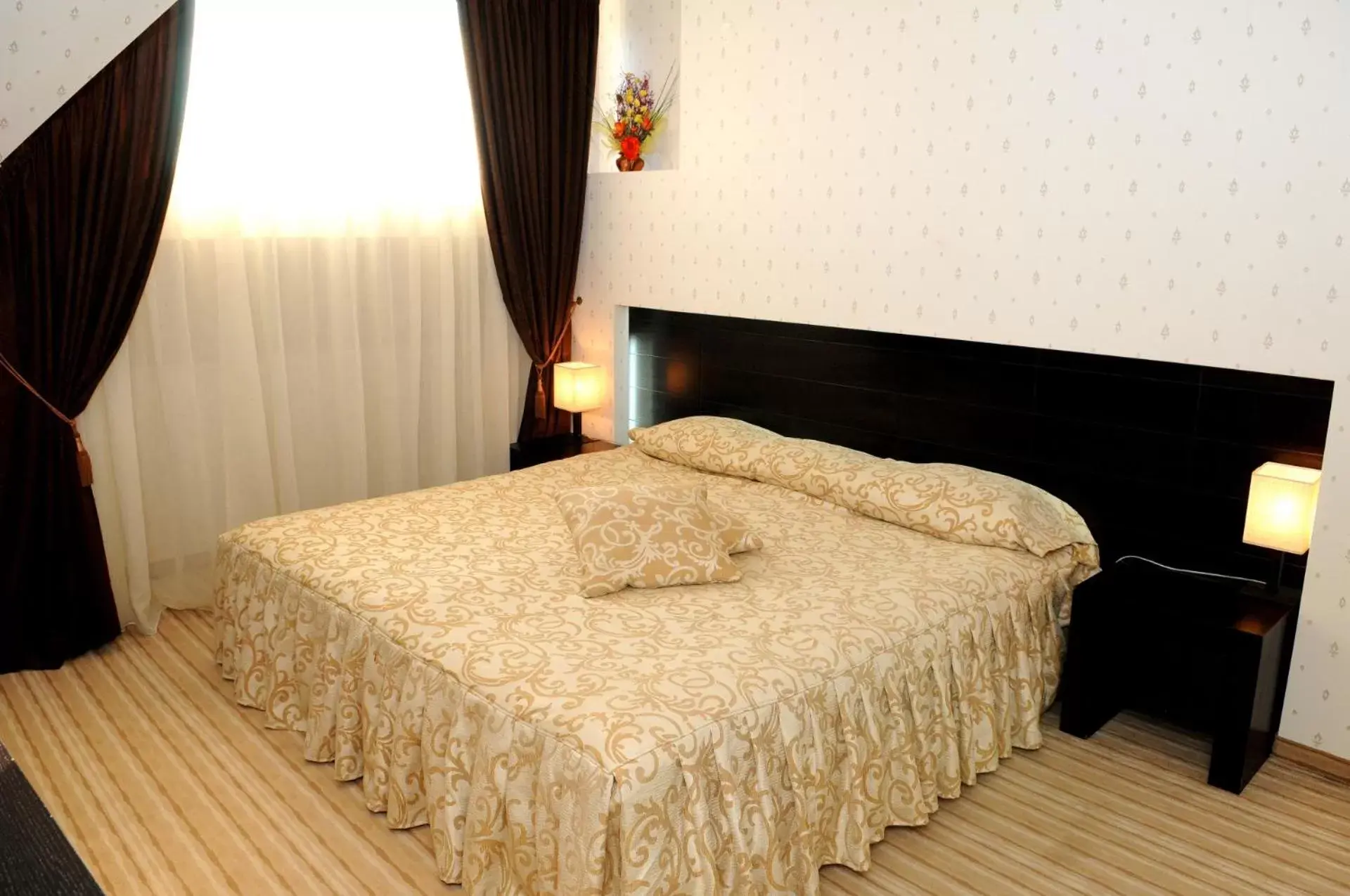 Bed in Gardenia Park Hotel