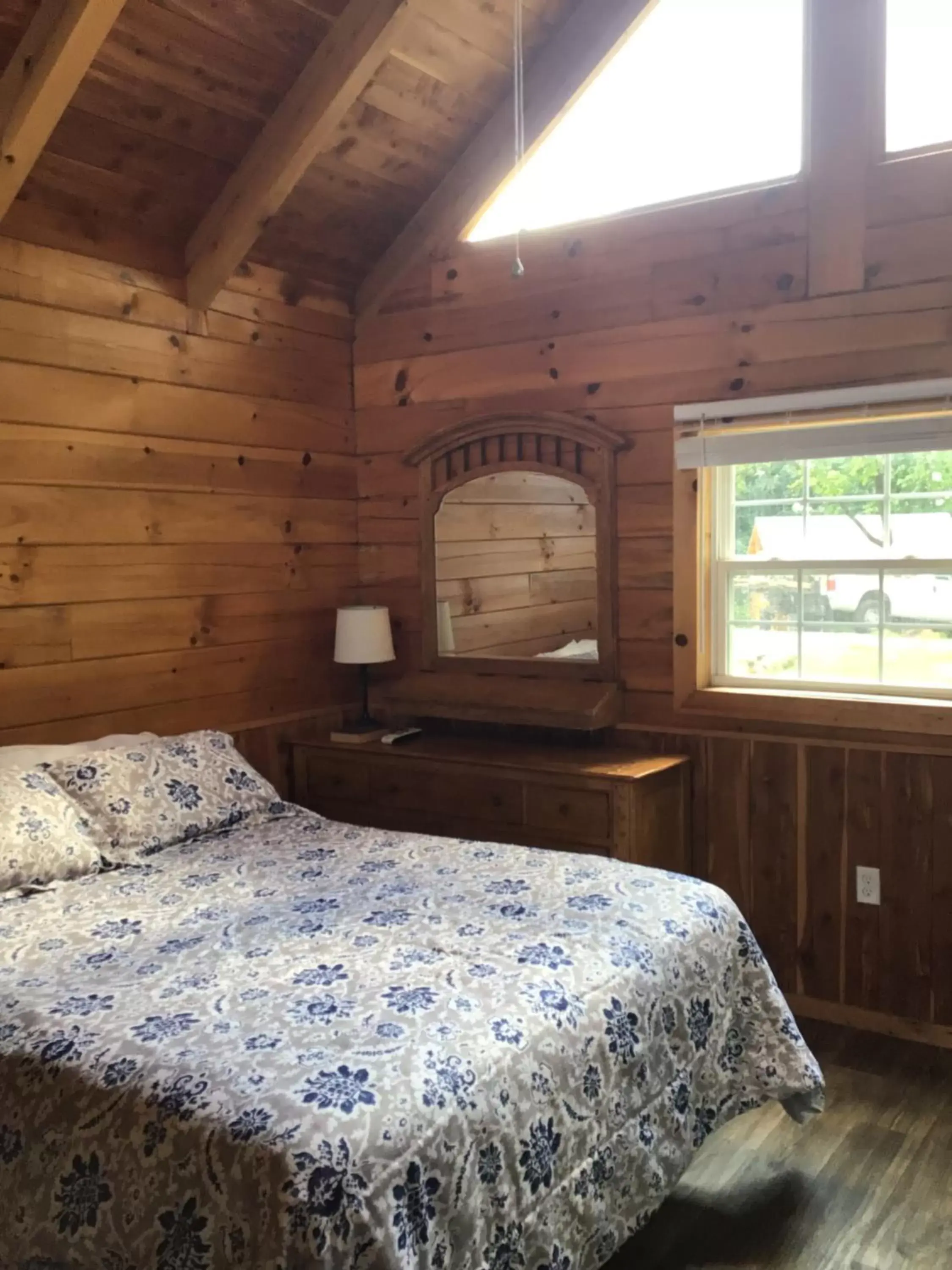 Bed in Kozy Haven Log Cabin Rentals