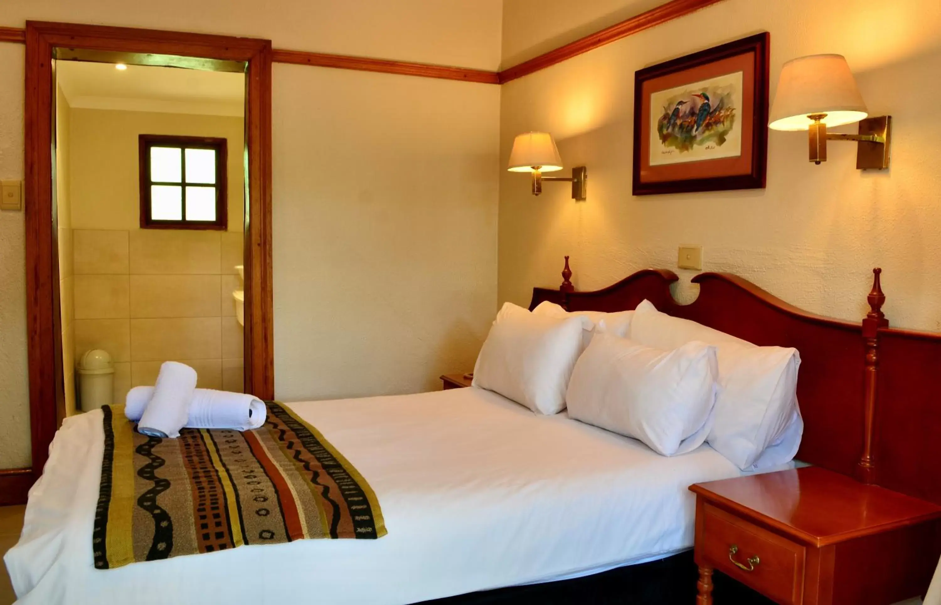 Bed in Hotel Numbi & Garden Suites