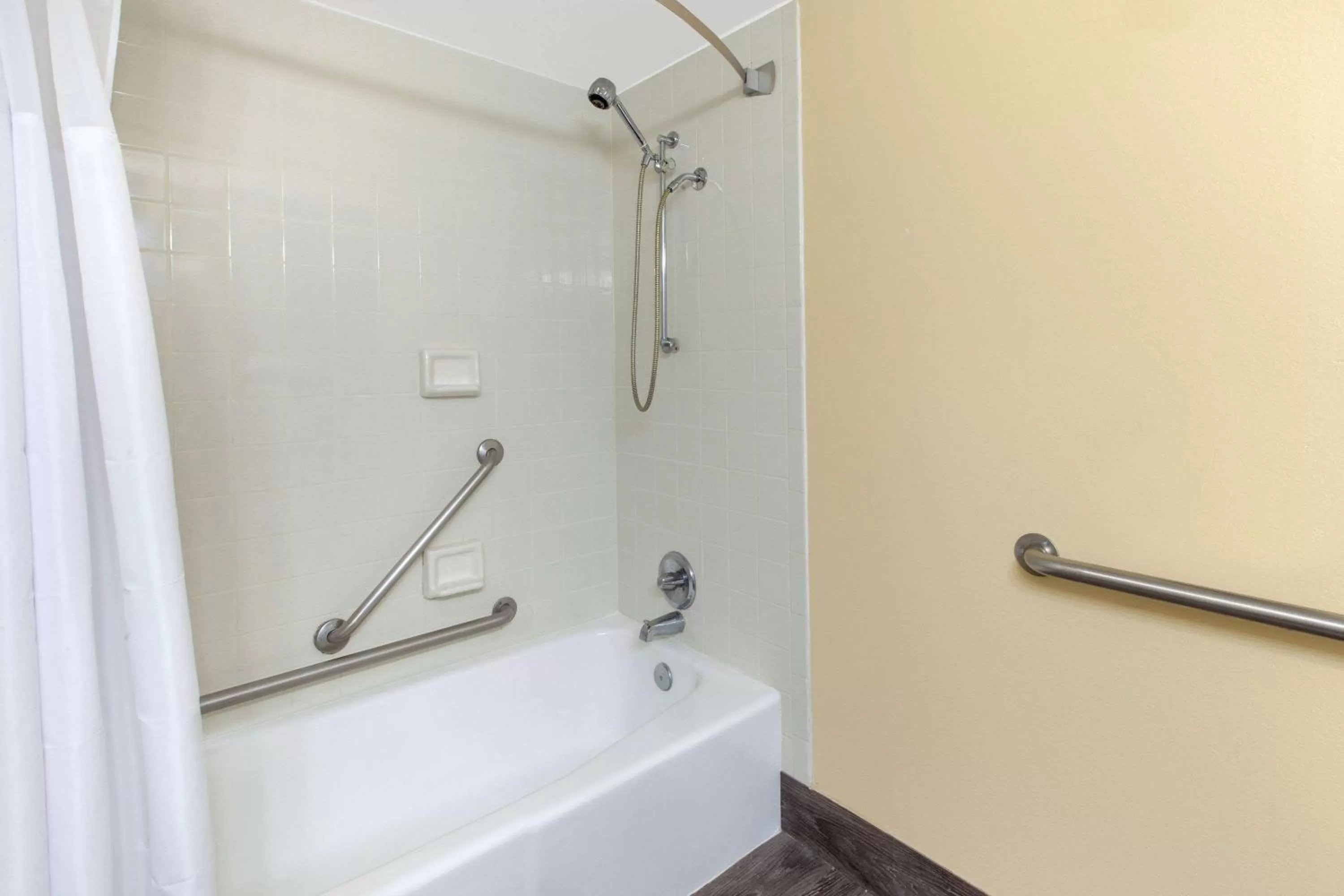 Bathroom in Days Inn & Suites by Wyndham Grand Rapids Near Downtown