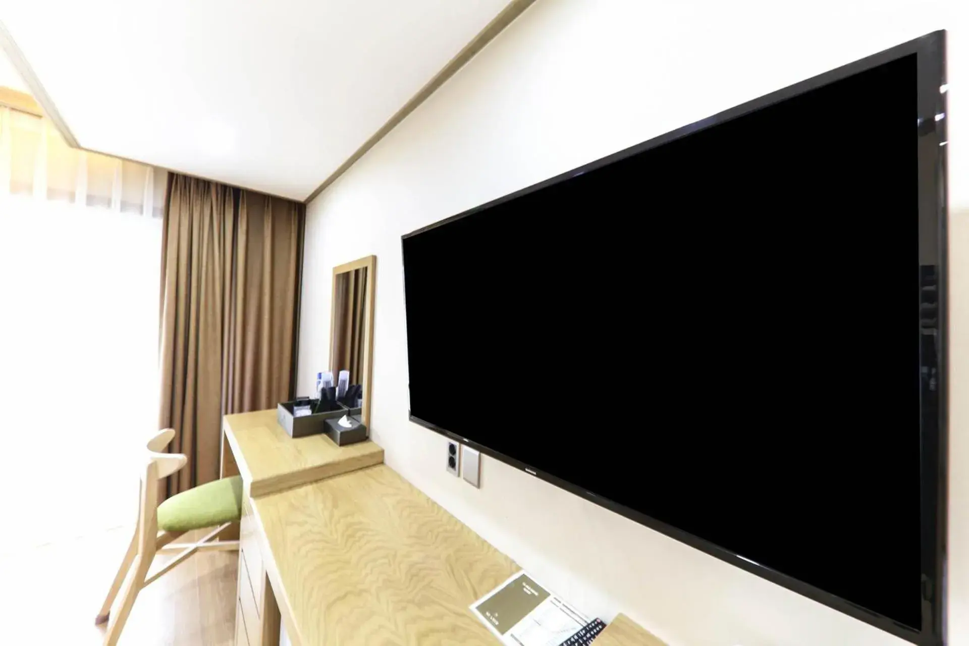 TV and multimedia, TV/Entertainment Center in Nohyung Hotel