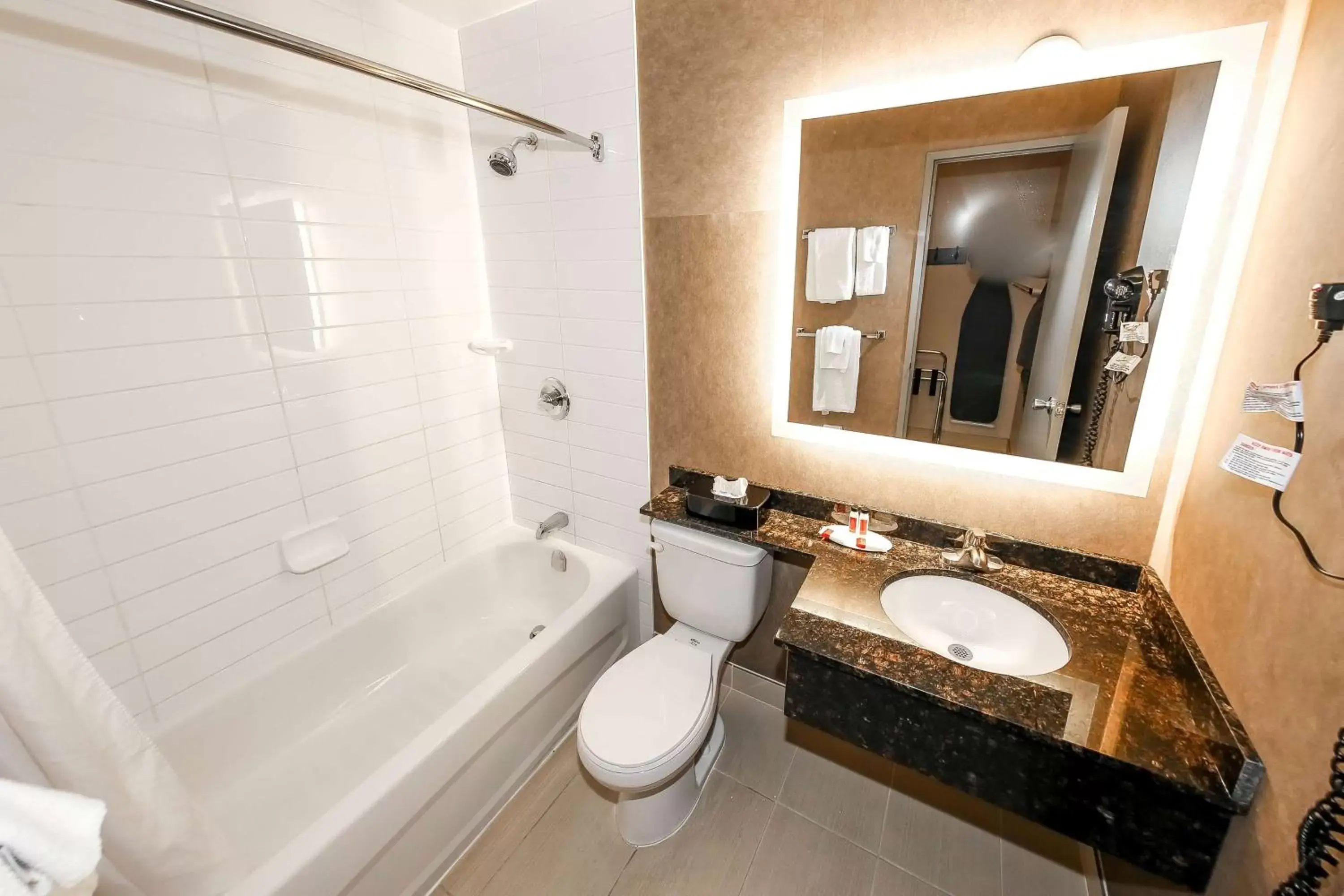 Bathroom in Howard Johnson by Wyndham Winnipeg West