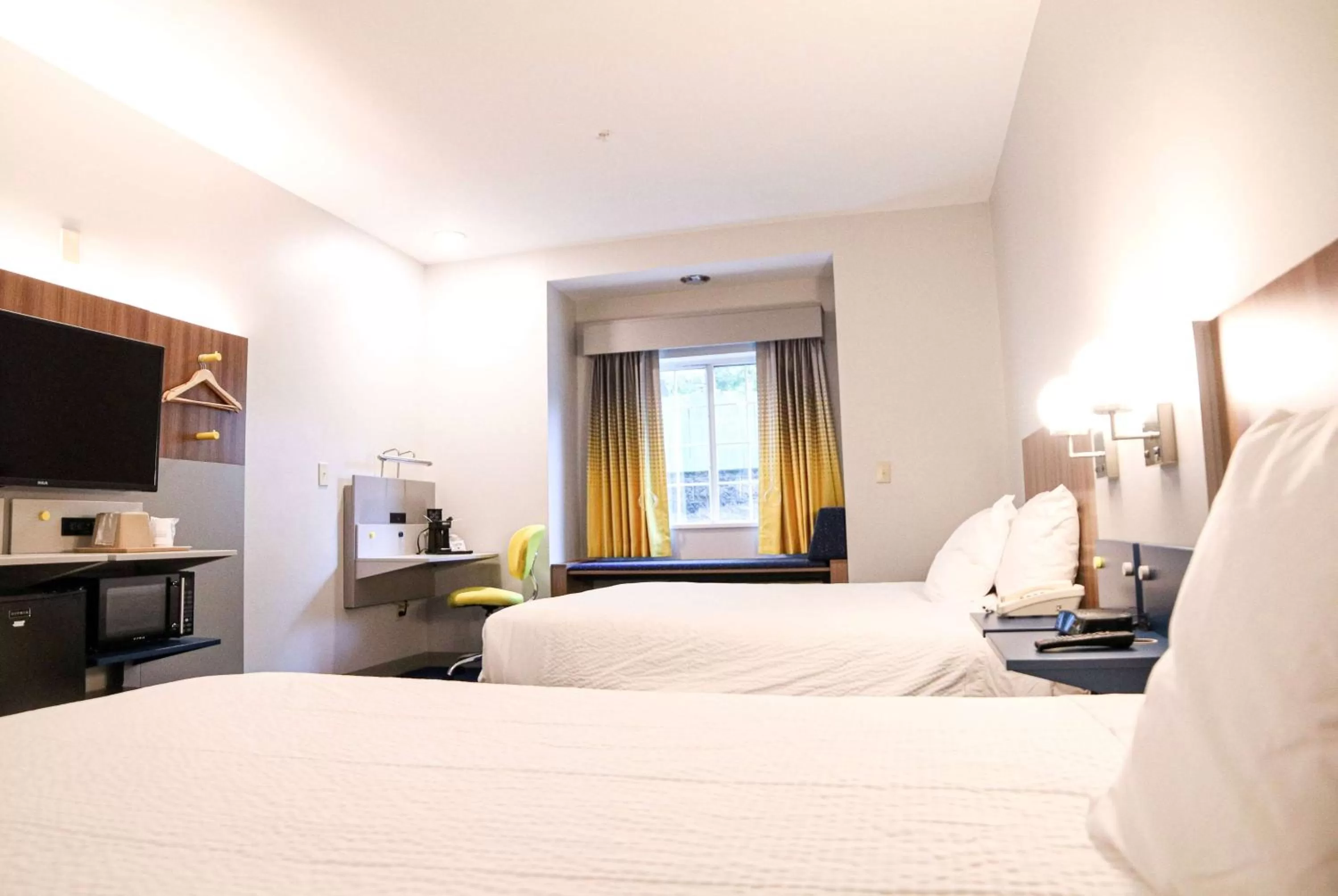 Bed in Microtel Inn & Suites by Wyndham Charlotte/Northlake