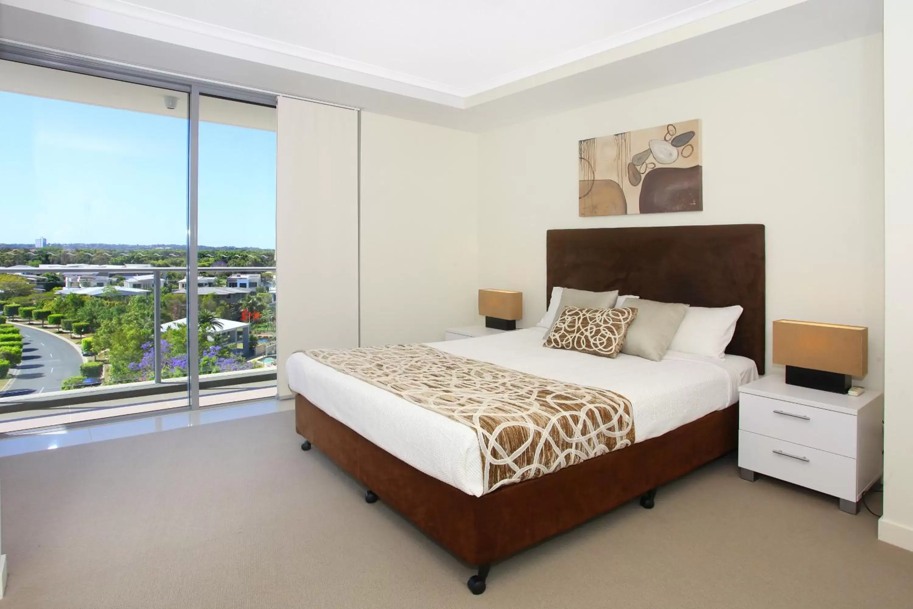 Bed in Signature Waterfront Apartments