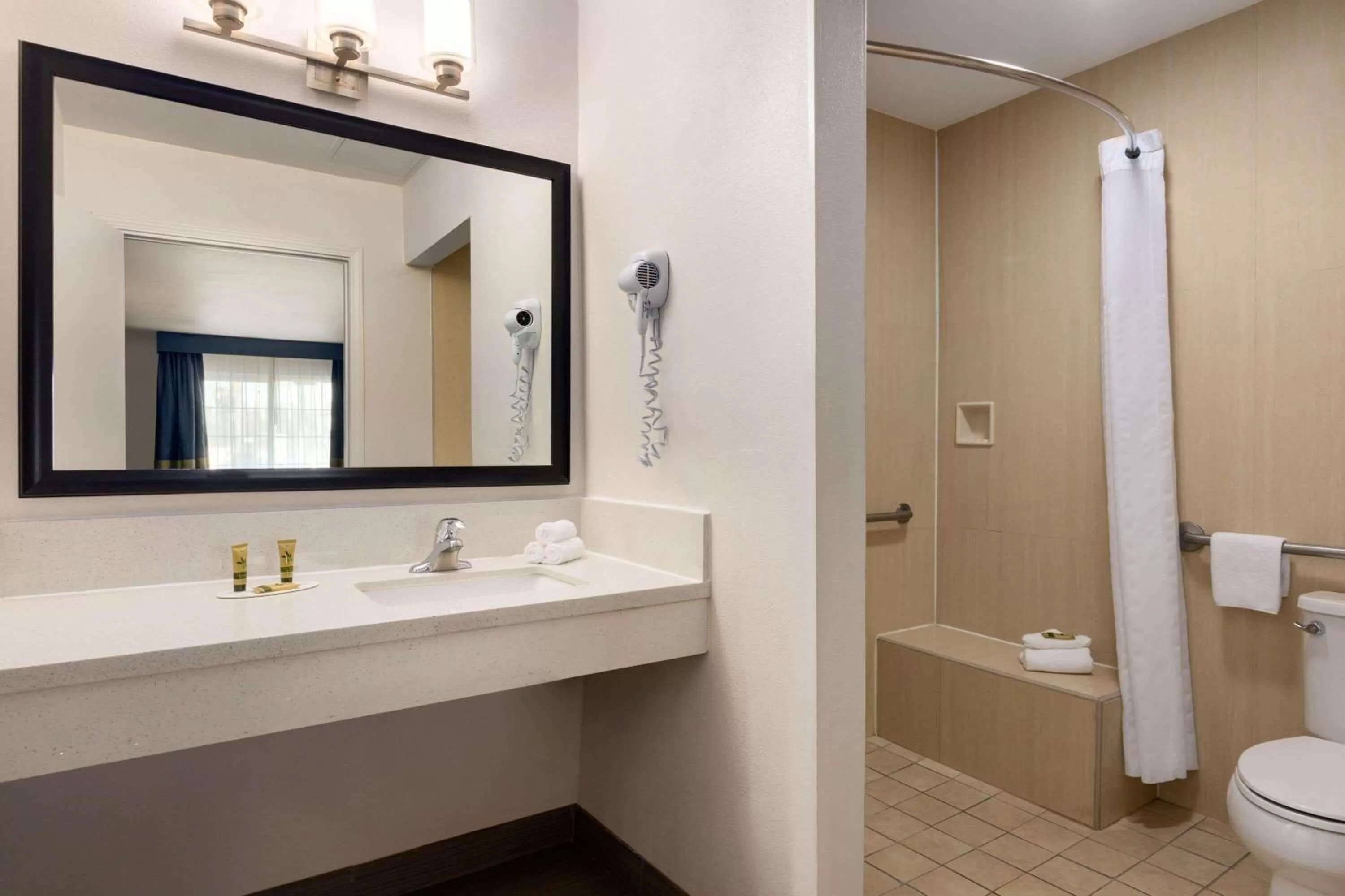 Bathroom in Days Inn & Suites by Wyndham Anaheim At Disneyland Park