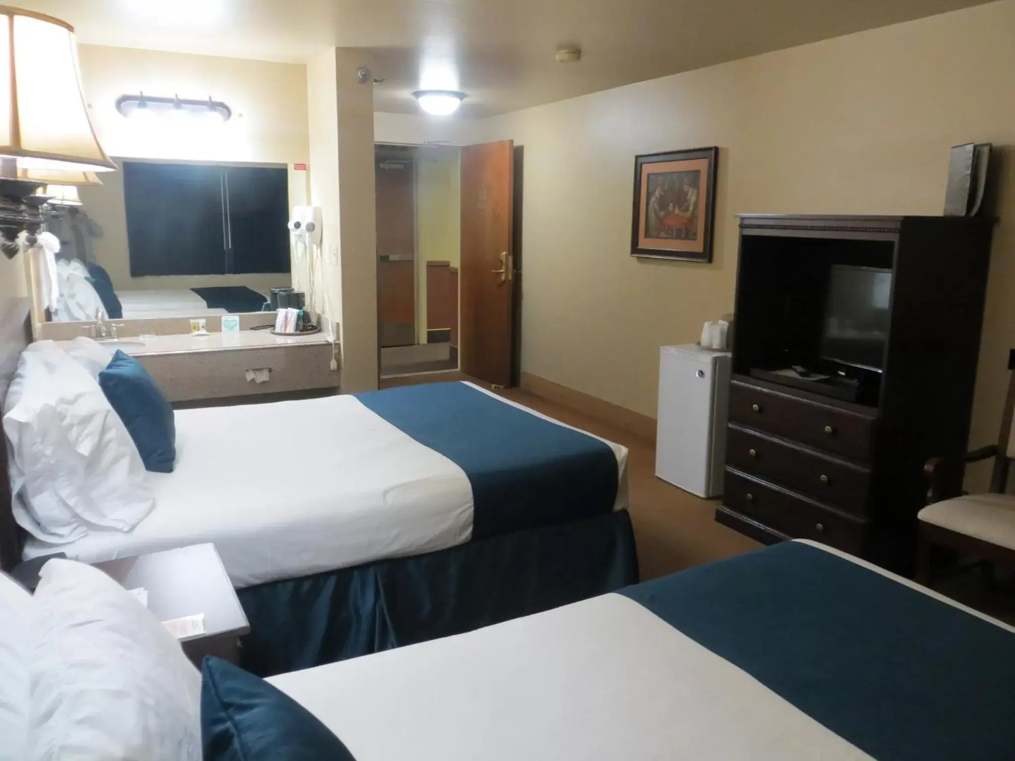 Bed, TV/Entertainment Center in First Gold Gaming Resort