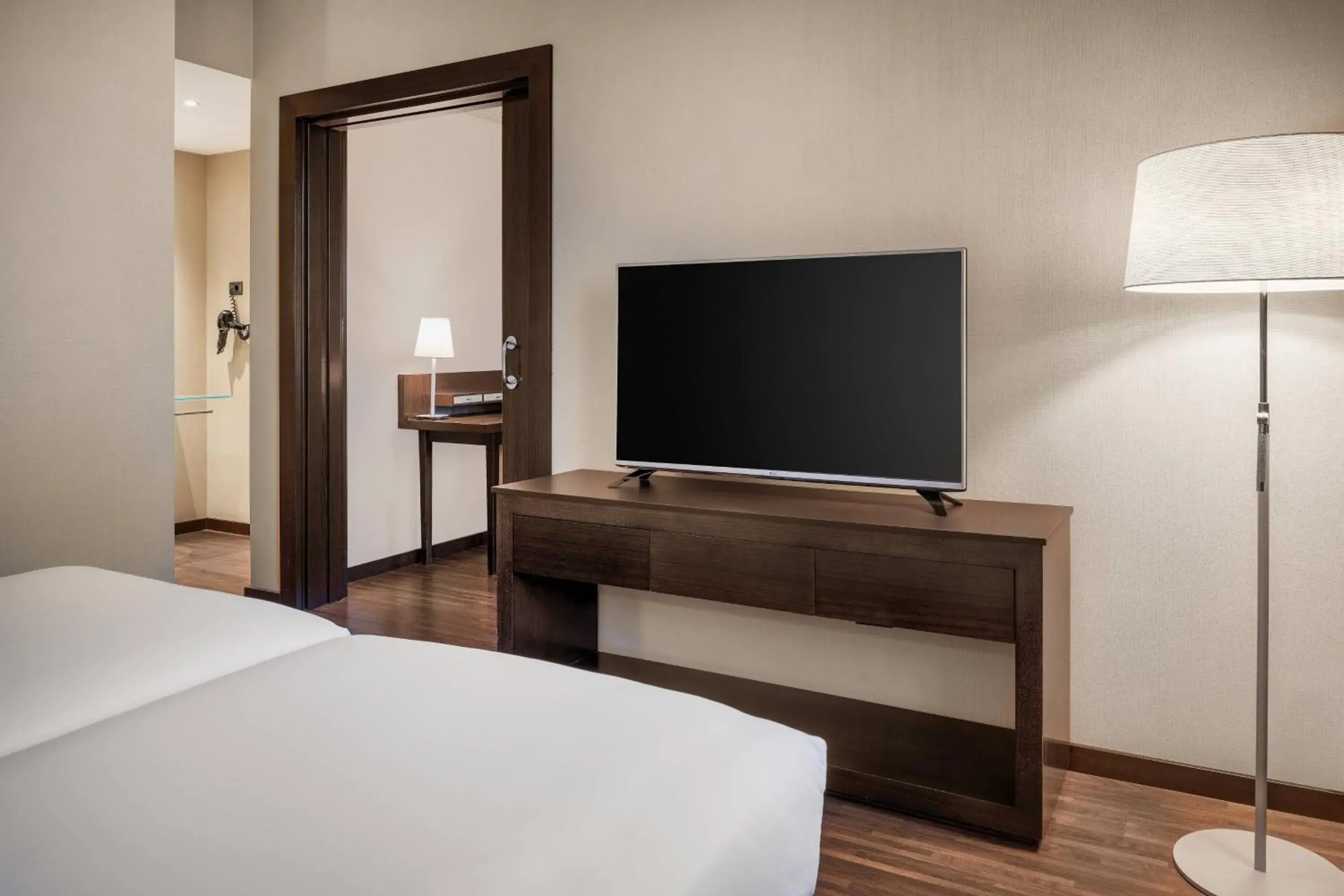 Photo of the whole room, TV/Entertainment Center in AC Hotel Barcelona Fórum by Marriott