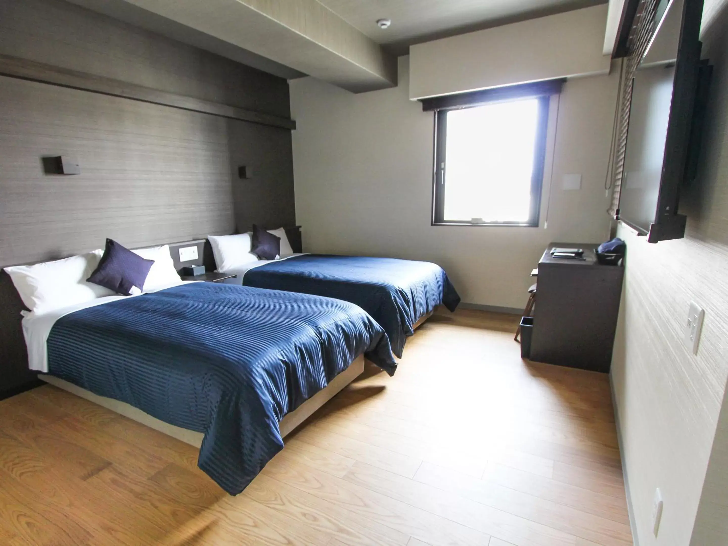 Bed in HOTEL LiVEMAX PREMIUM Himejieki-Minami