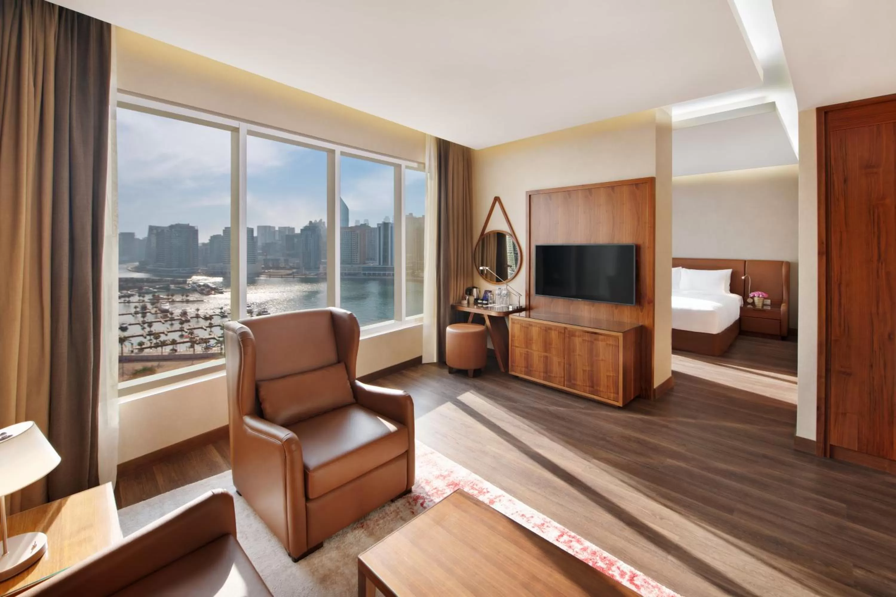 Living room, Bed in Radisson Blu Hotel, Dubai Canal View