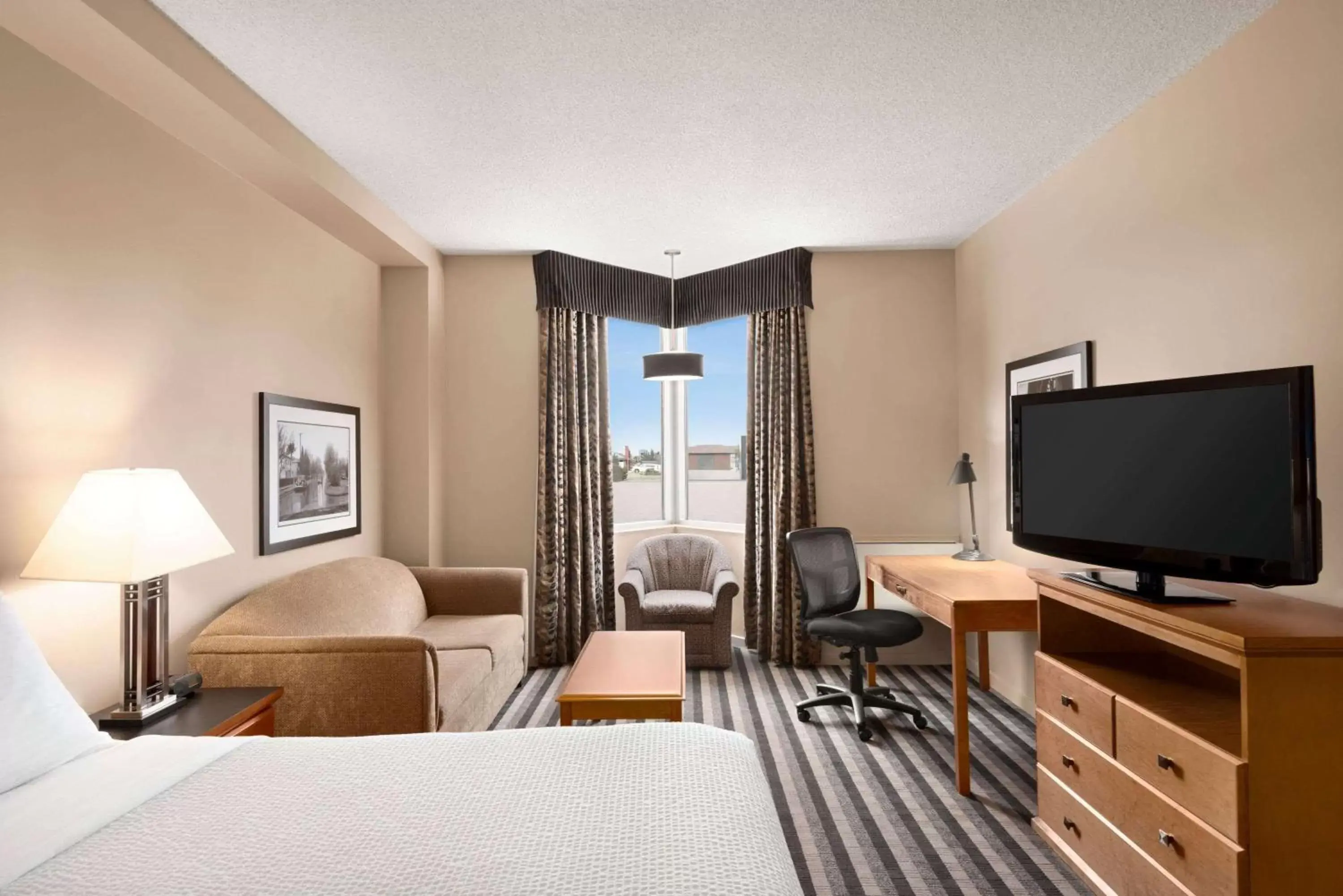 Photo of the whole room, TV/Entertainment Center in Royal Hotel West Edmonton, Trademark Collection by Wyndham