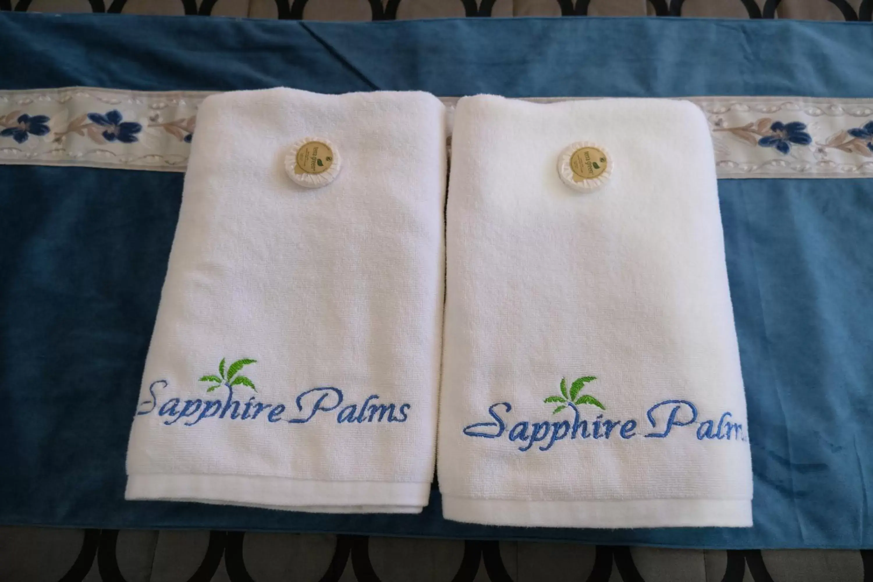 towels, Bed in Sapphire Palms Motel