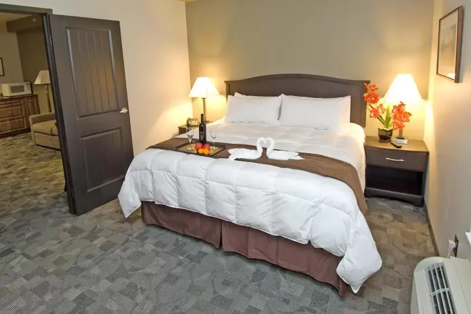 Bed in Midland Inn & Suites