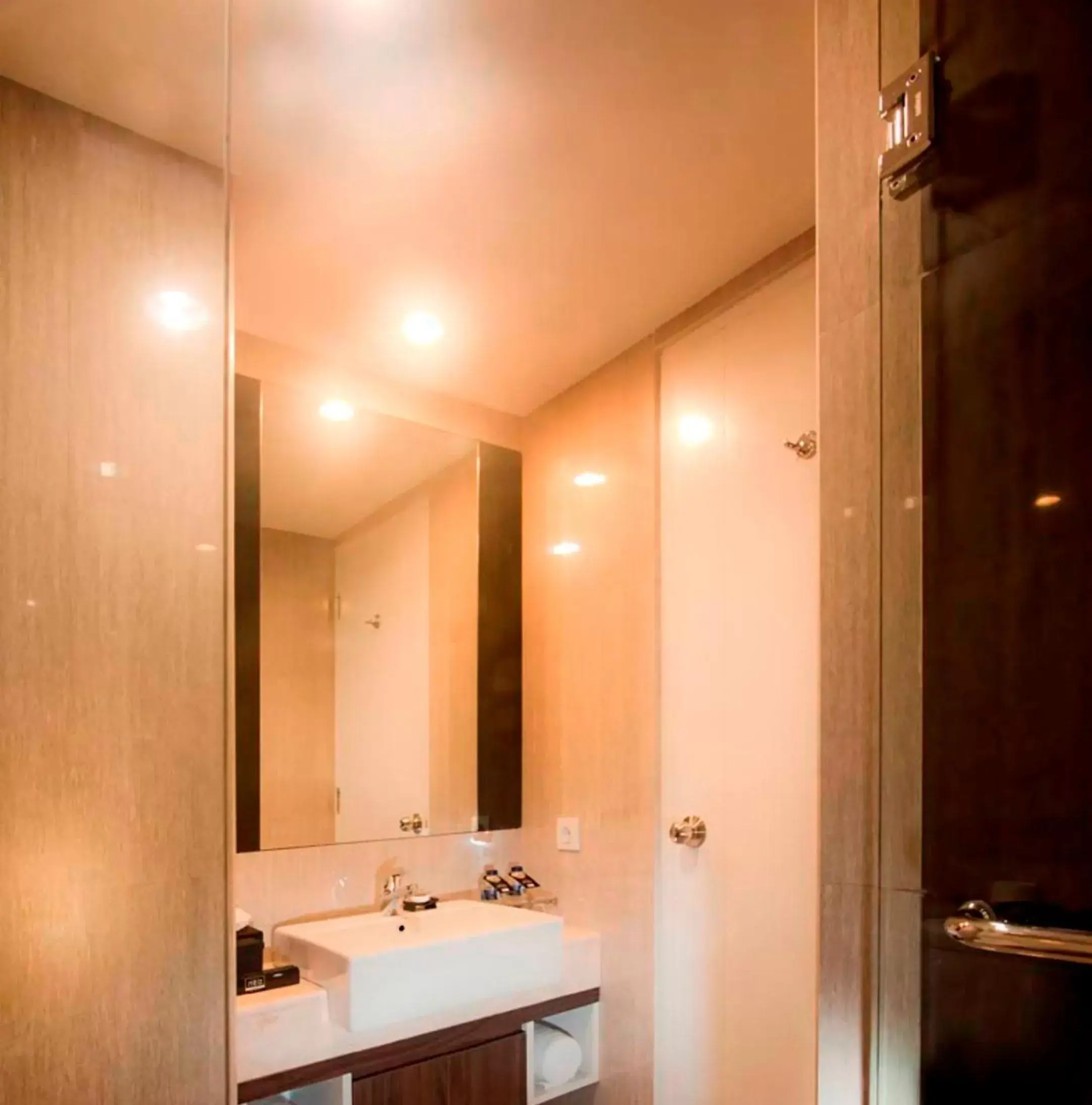 Bathroom in Neo Hotel Mangga Dua by ASTON