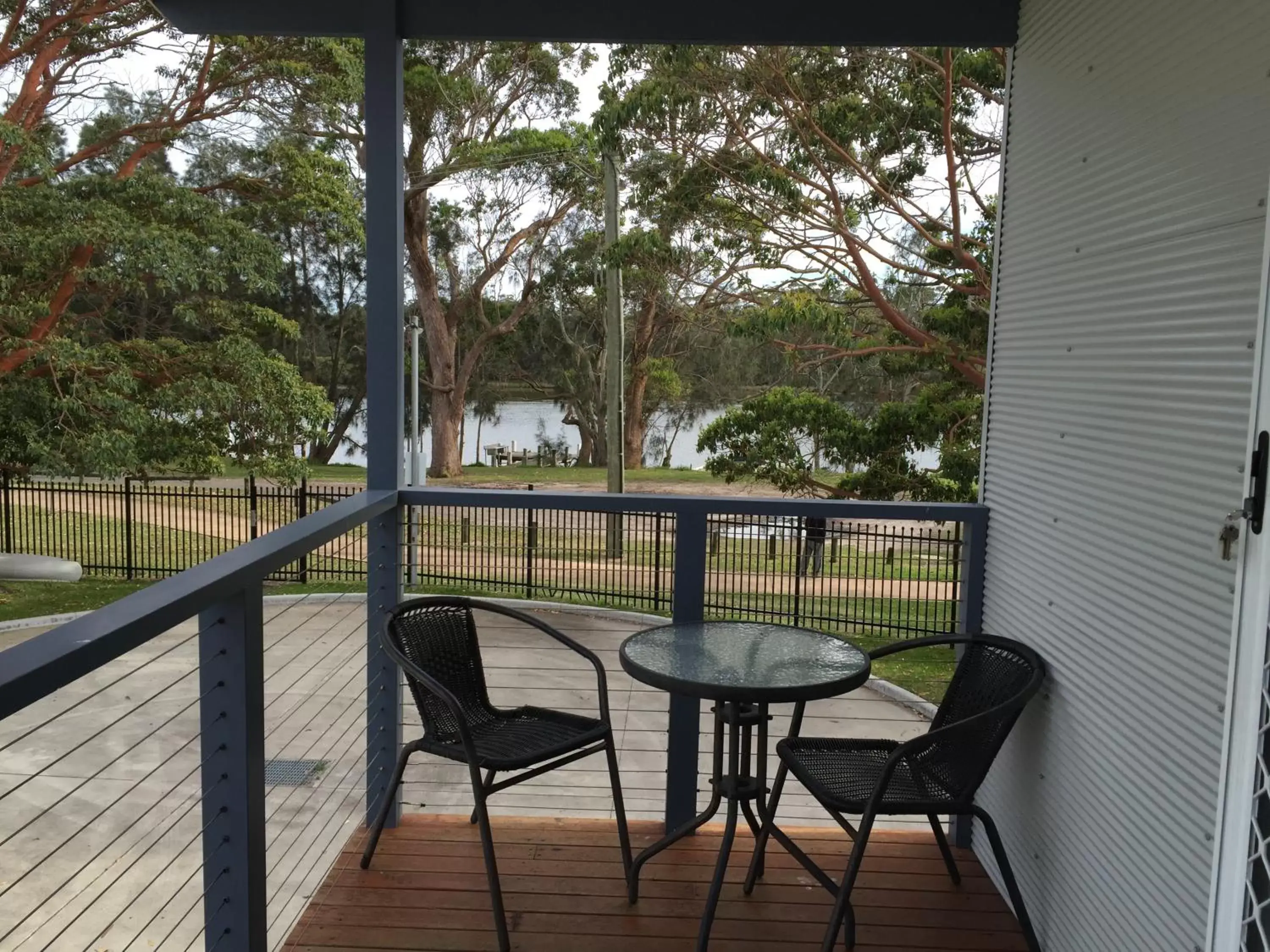 Photo of the whole room, Balcony/Terrace in Peace Resorts - Jervis Bay Holiday Cabins in Sussex Inlet