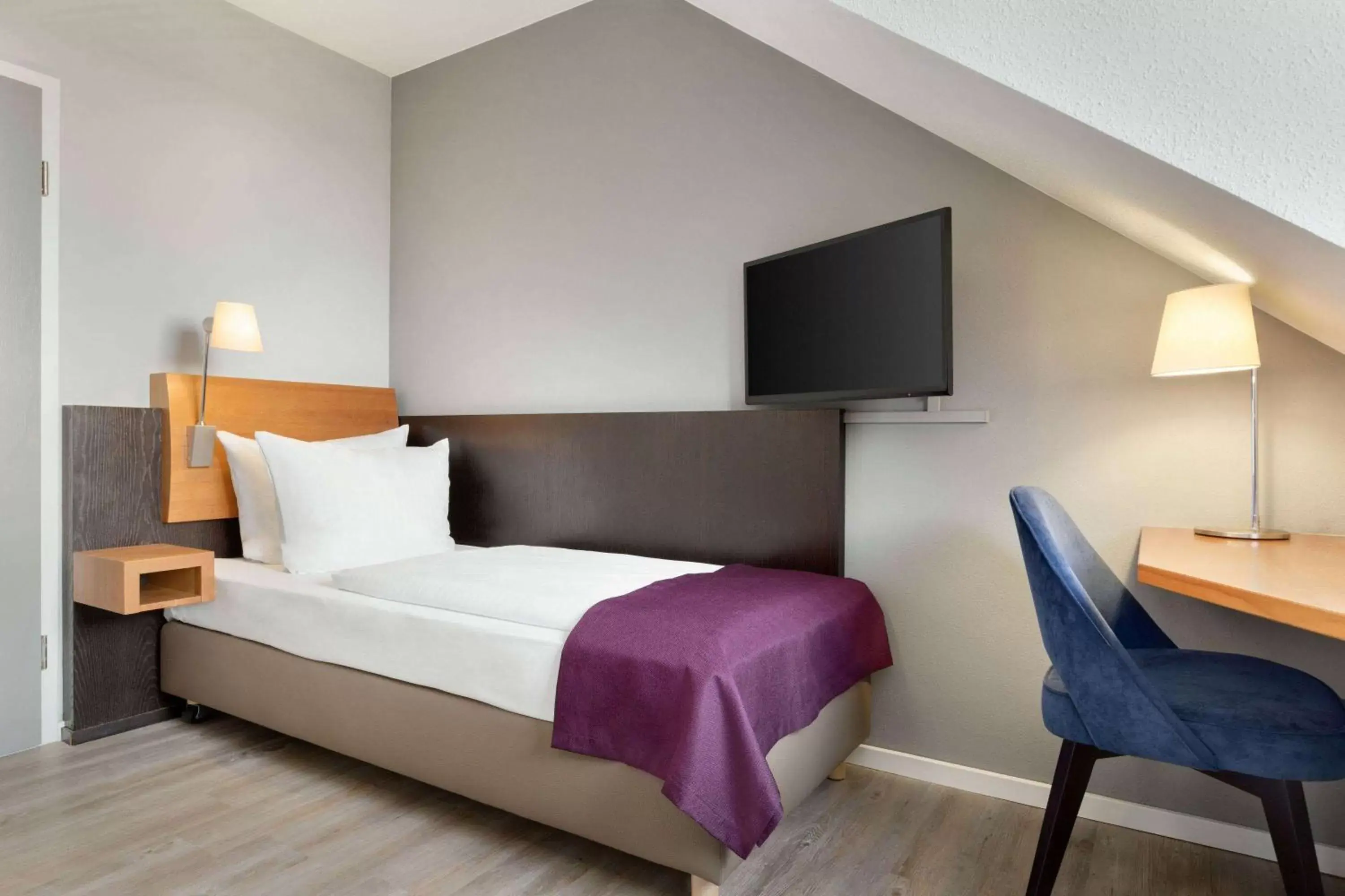 Photo of the whole room, Bed in Ramada by Wyndham München Airport Photo of the whole room, Bed in Ramada by Wyndham München Airport