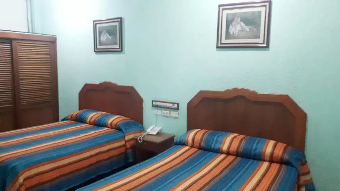 Bed in Hotel Azteca Tabasco