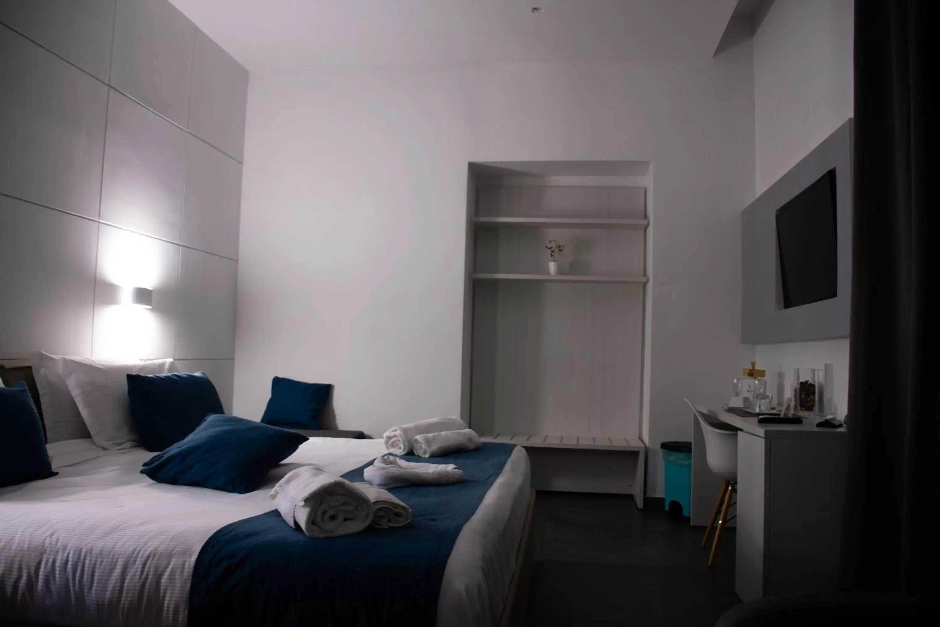 Bed in Megaris Luxury Suite Rooms