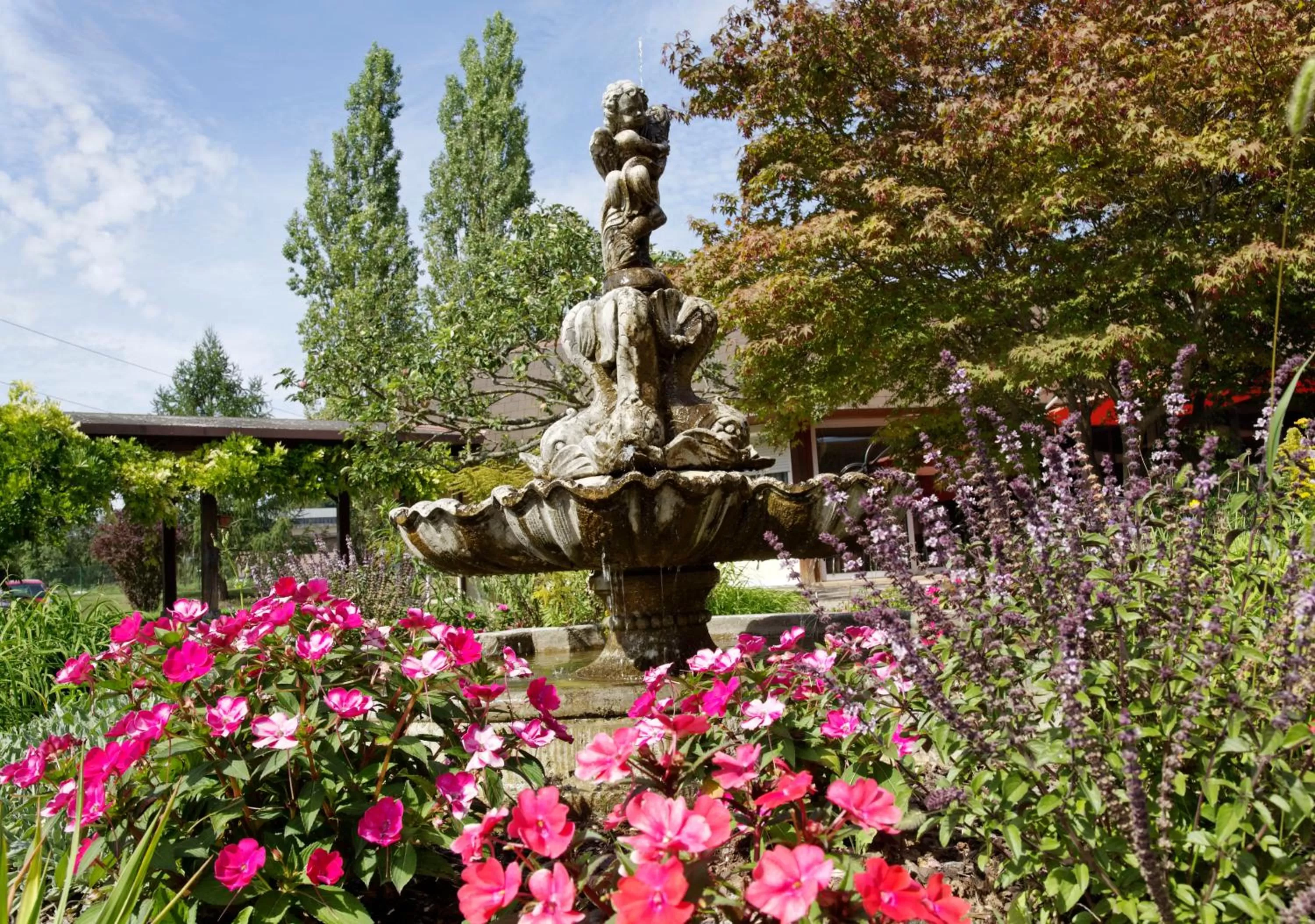 Garden in Charme Hôtel, Montbéliard Sud