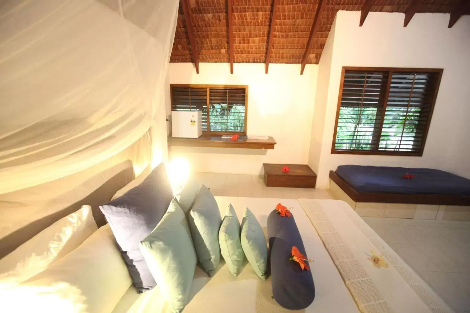 Bed, Seating Area in Breakas Beach Resort