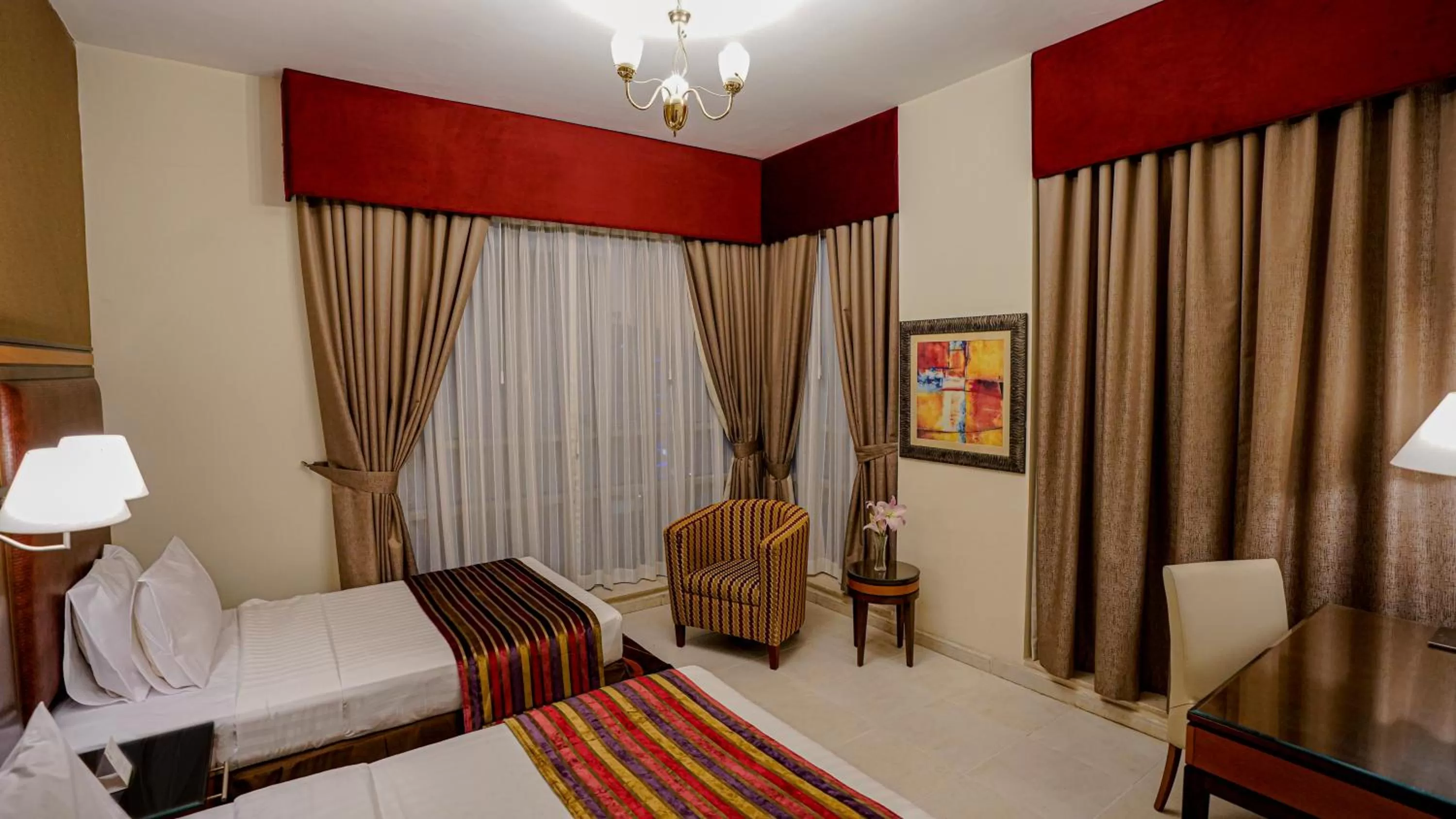 Bed in Xclusive Hotel Apartments