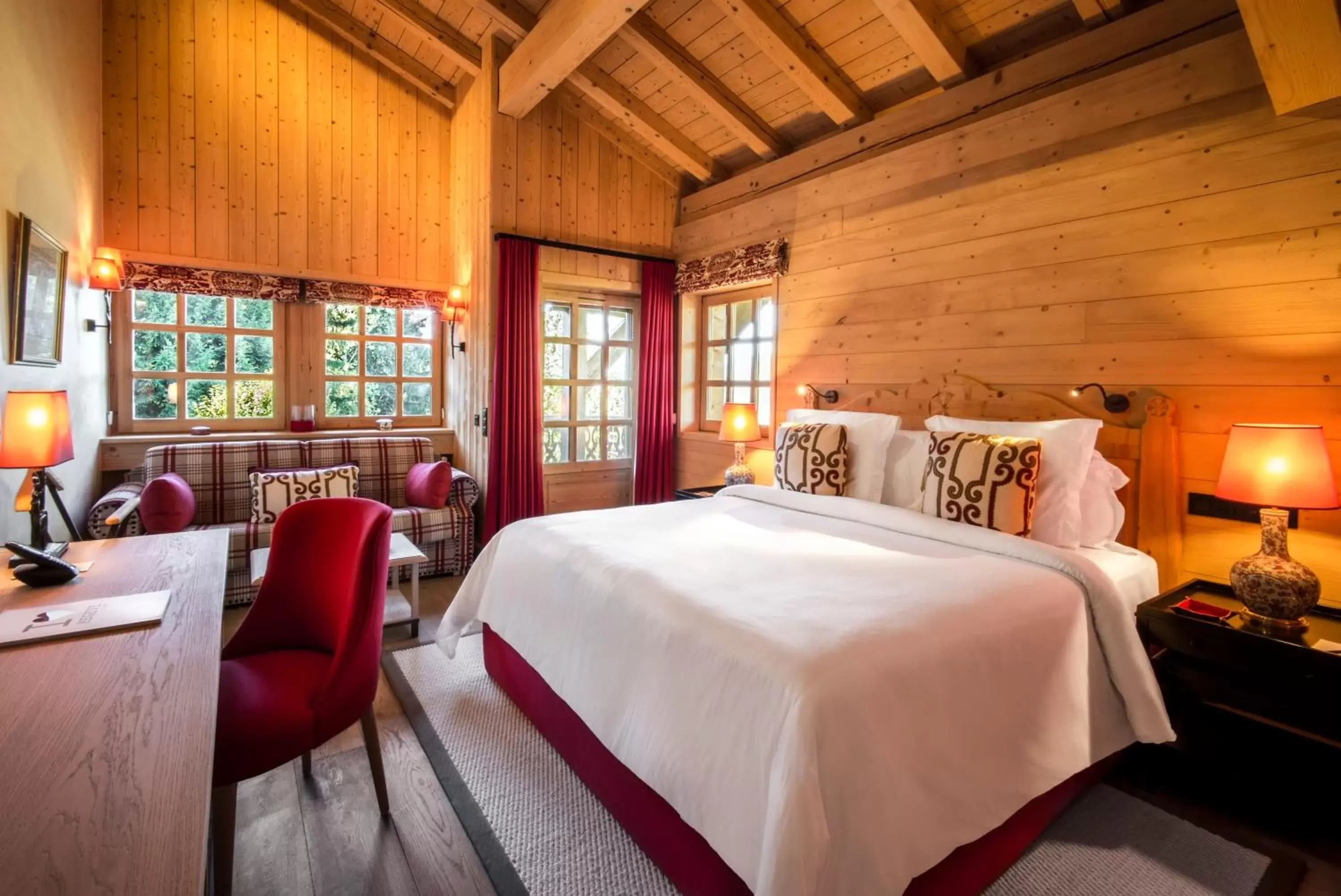 Bed in Les Chalets du Mont d'Arbois Megeve, a Four Seasons Hotel