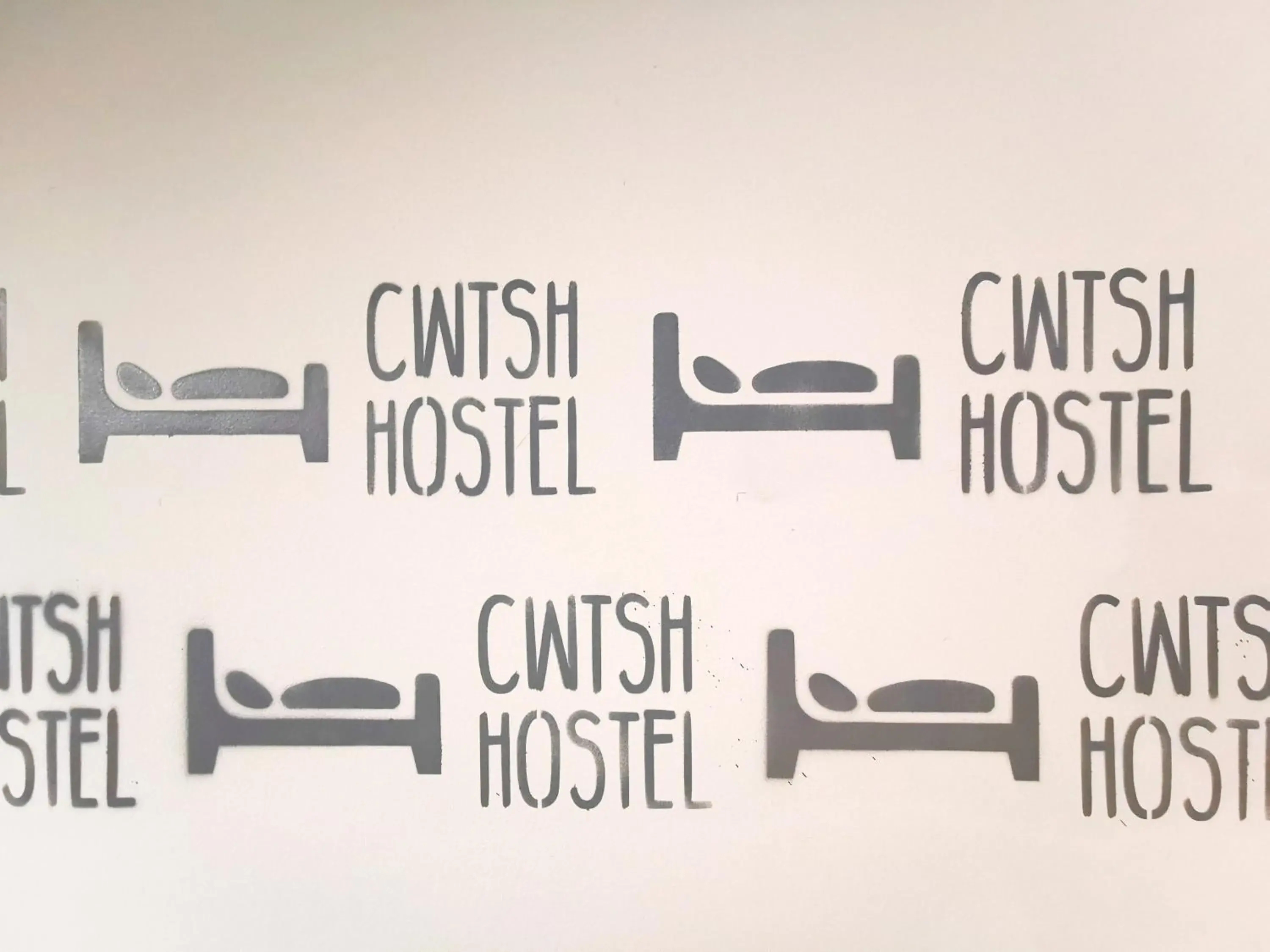 Property logo or sign in Cwtsh Hostel
