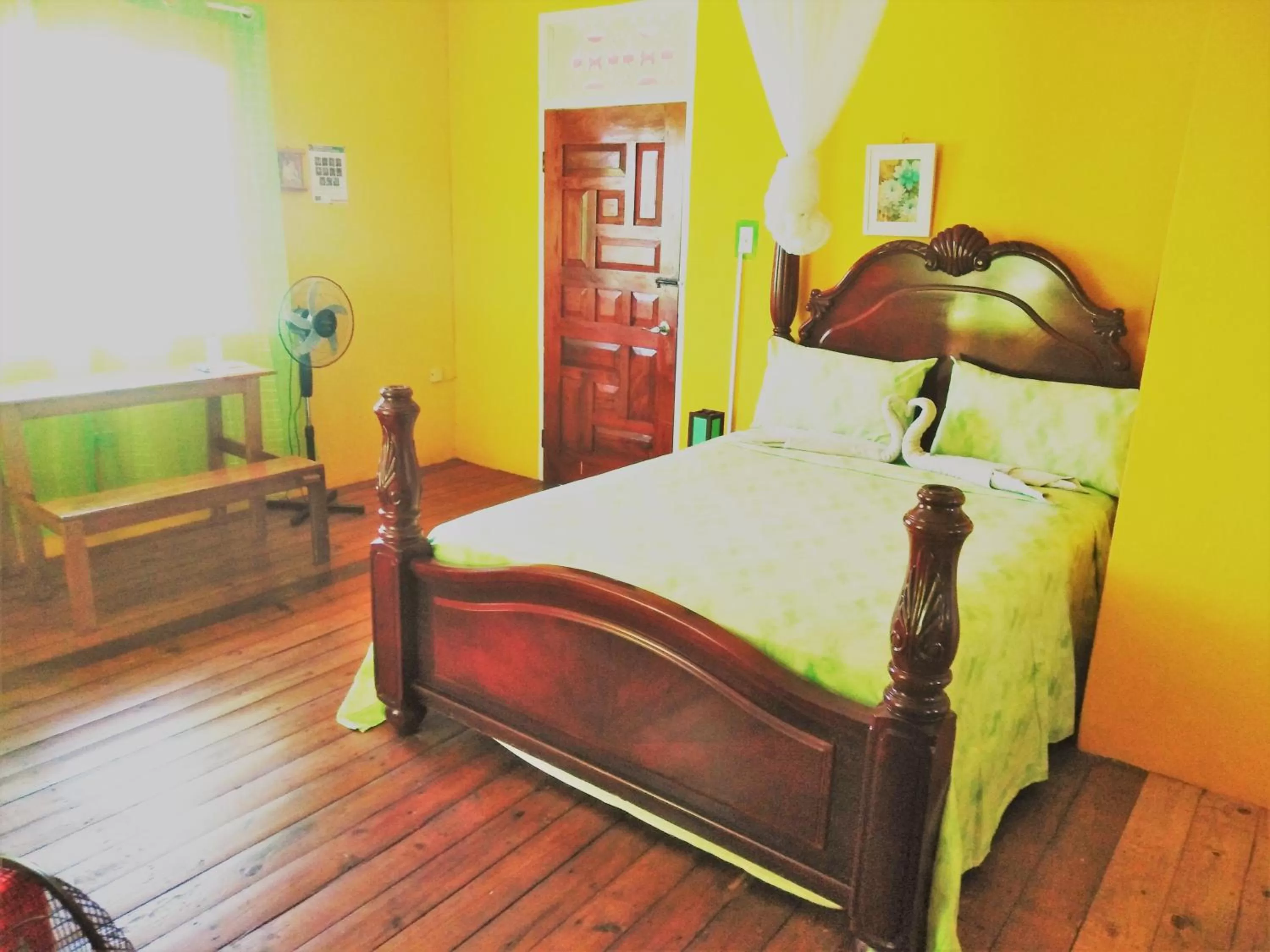 Bed in TOGA GUEST HOUSE