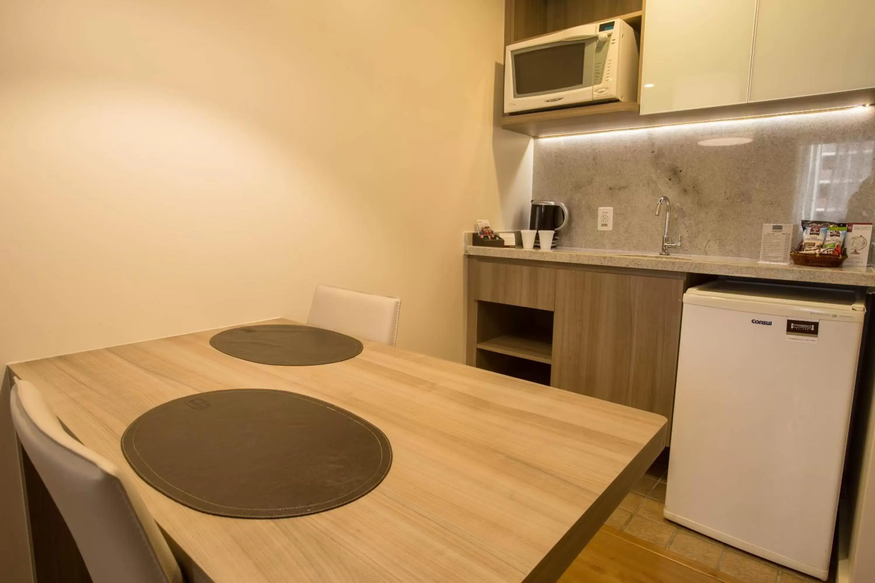 Photo of the whole room, Kitchen/Kitchenette in Staybridge Suites São Paulo, an IHG Hotel
