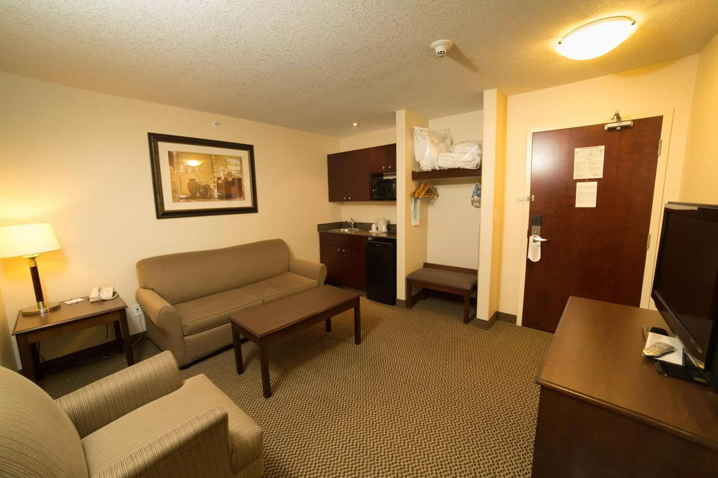 Bedroom, Seating Area in Holiday Inn Express Hotel & Suites - Slave Lake, an IHG Hotel