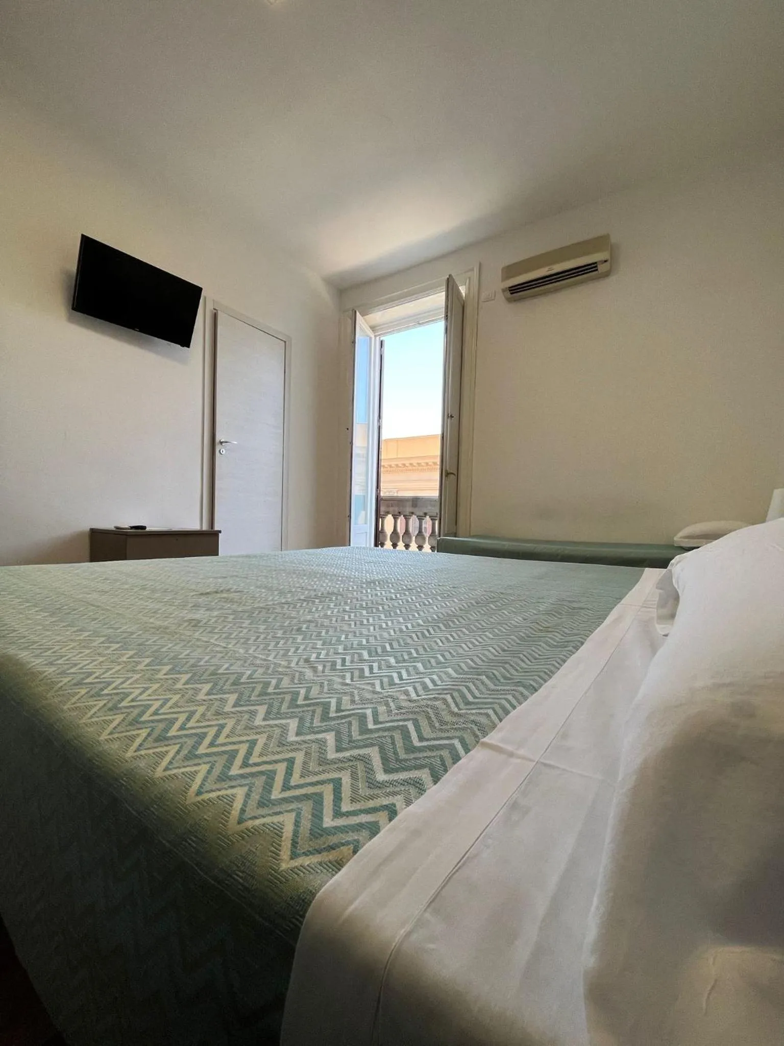 Bed in 38 Aira Hotels