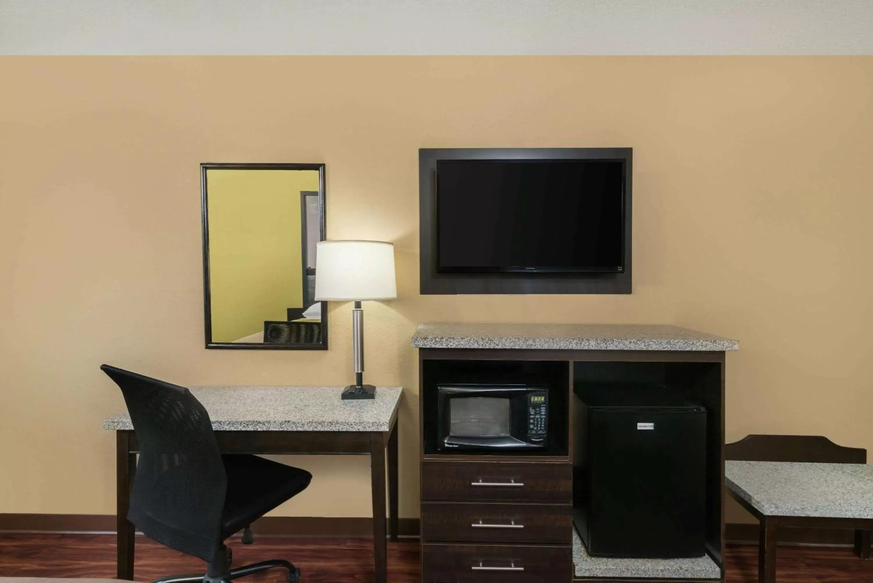 Photo of the whole room, TV/Entertainment Center in Super 8 by Wyndham Raleigh North East