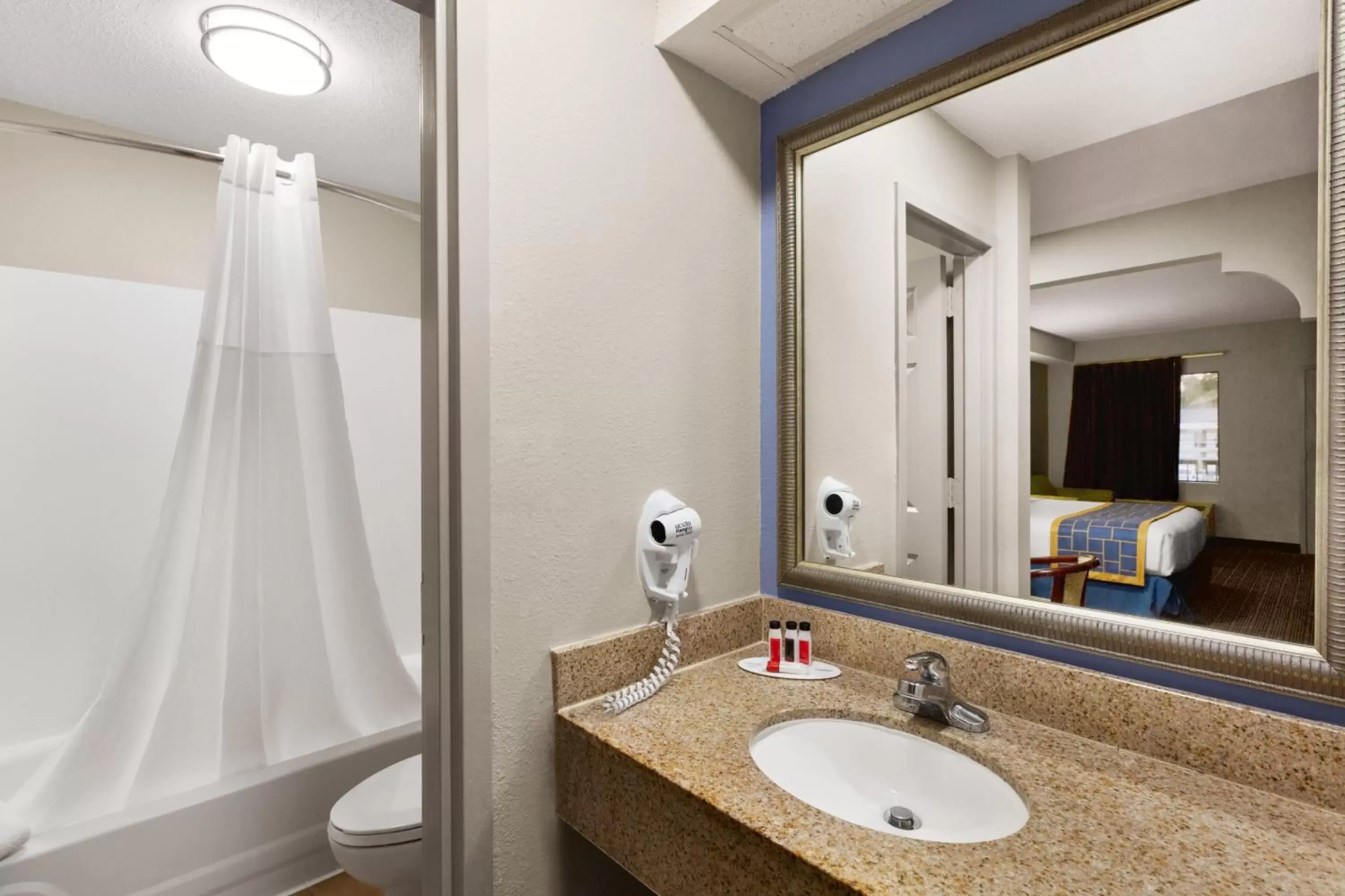 Bathroom in Days Inn & Suites by Wyndham Savannah Midtown