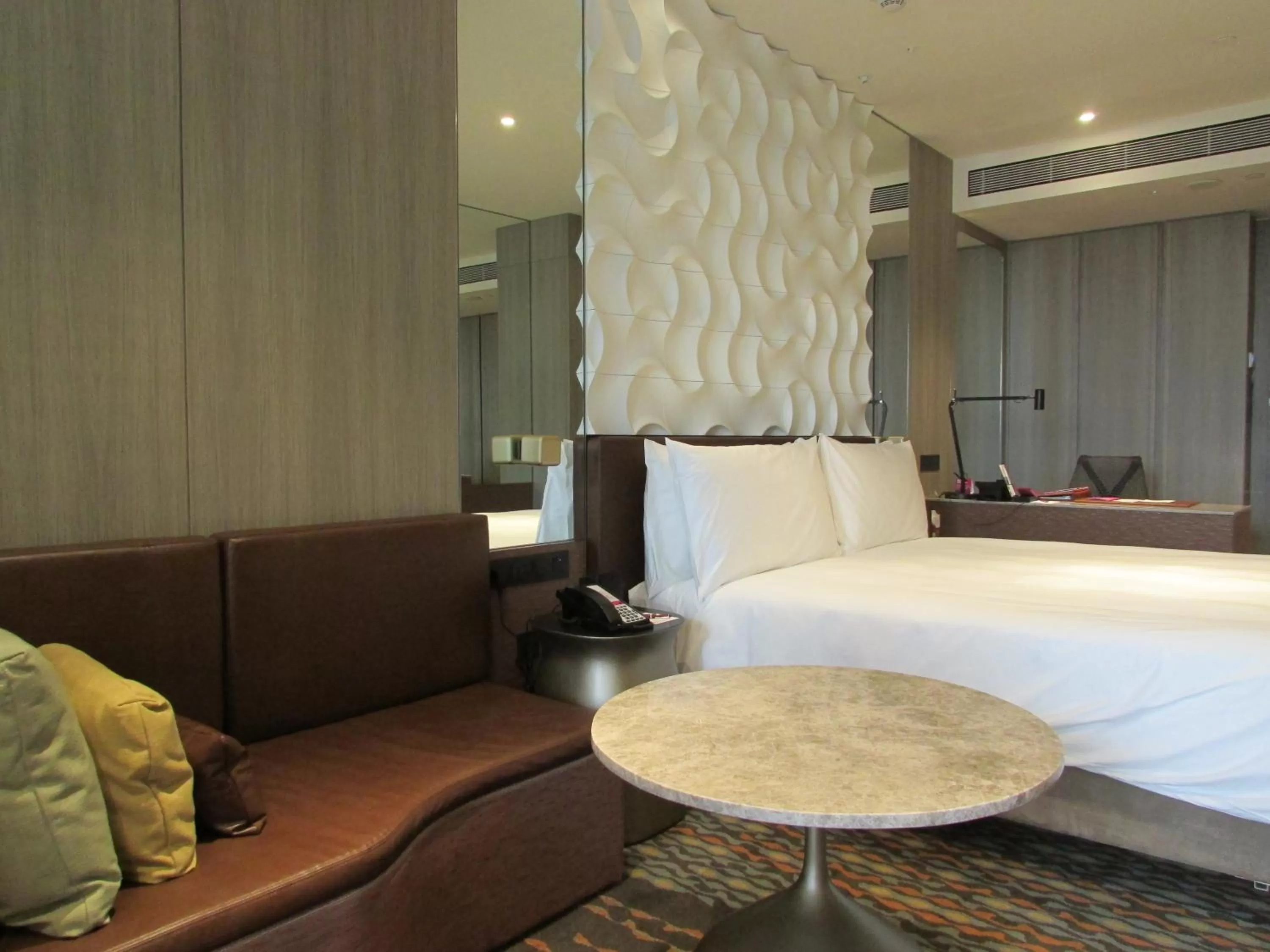 Seating area, Bed in Crowne Plaza Changi Airport by IHG