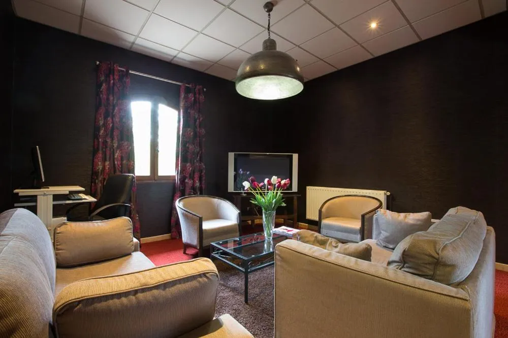 Communal lounge/ TV room in Hostellerie St Vincent