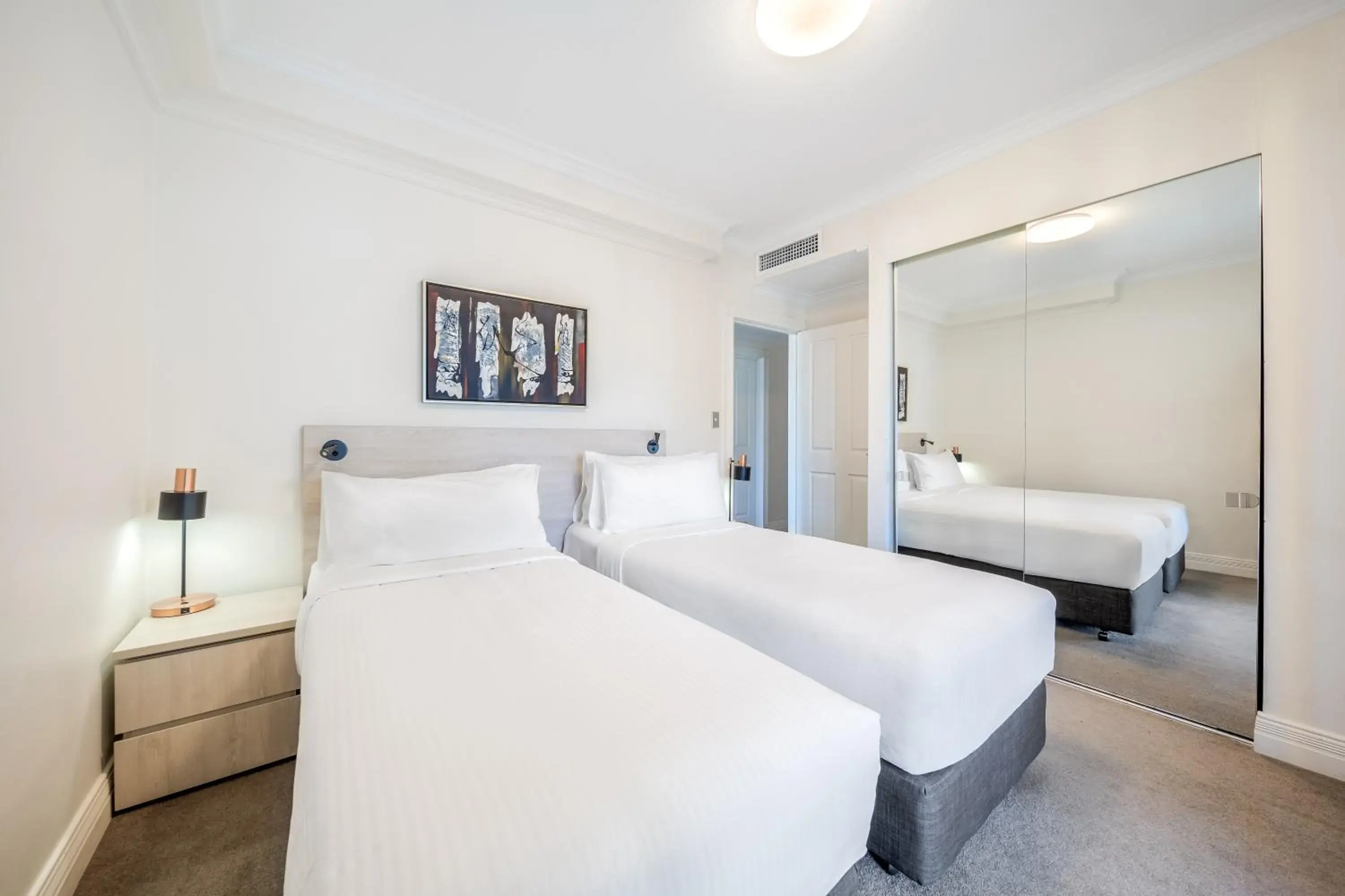 Bed in Oaks Sydney Castlereagh Suites