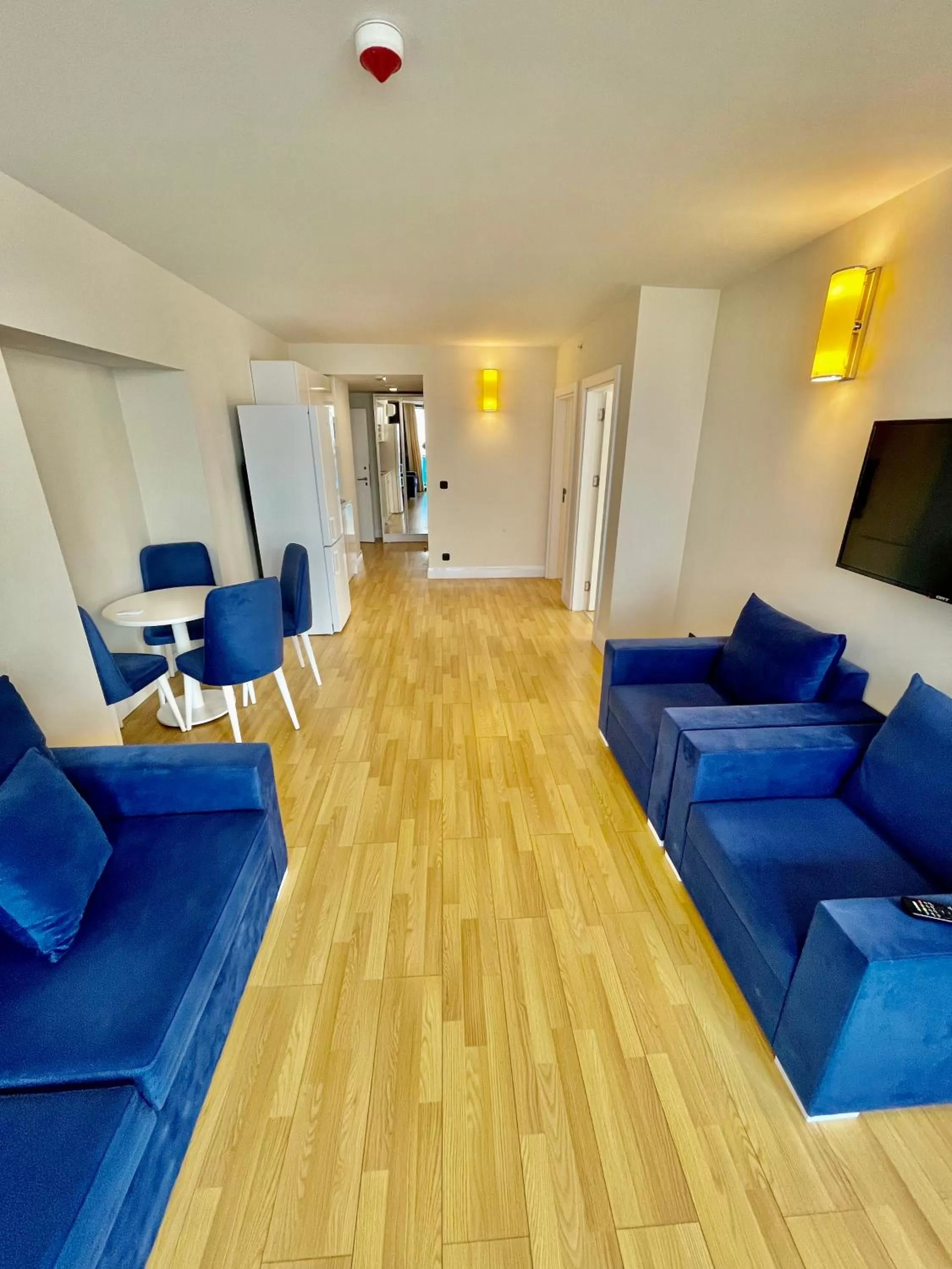 Communal lounge/ TV room, Seating Area in Orbi City Luxury Suite