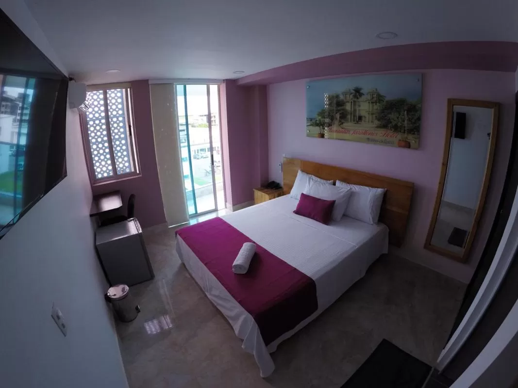 Bed in Kamaleb Farallones Hotel