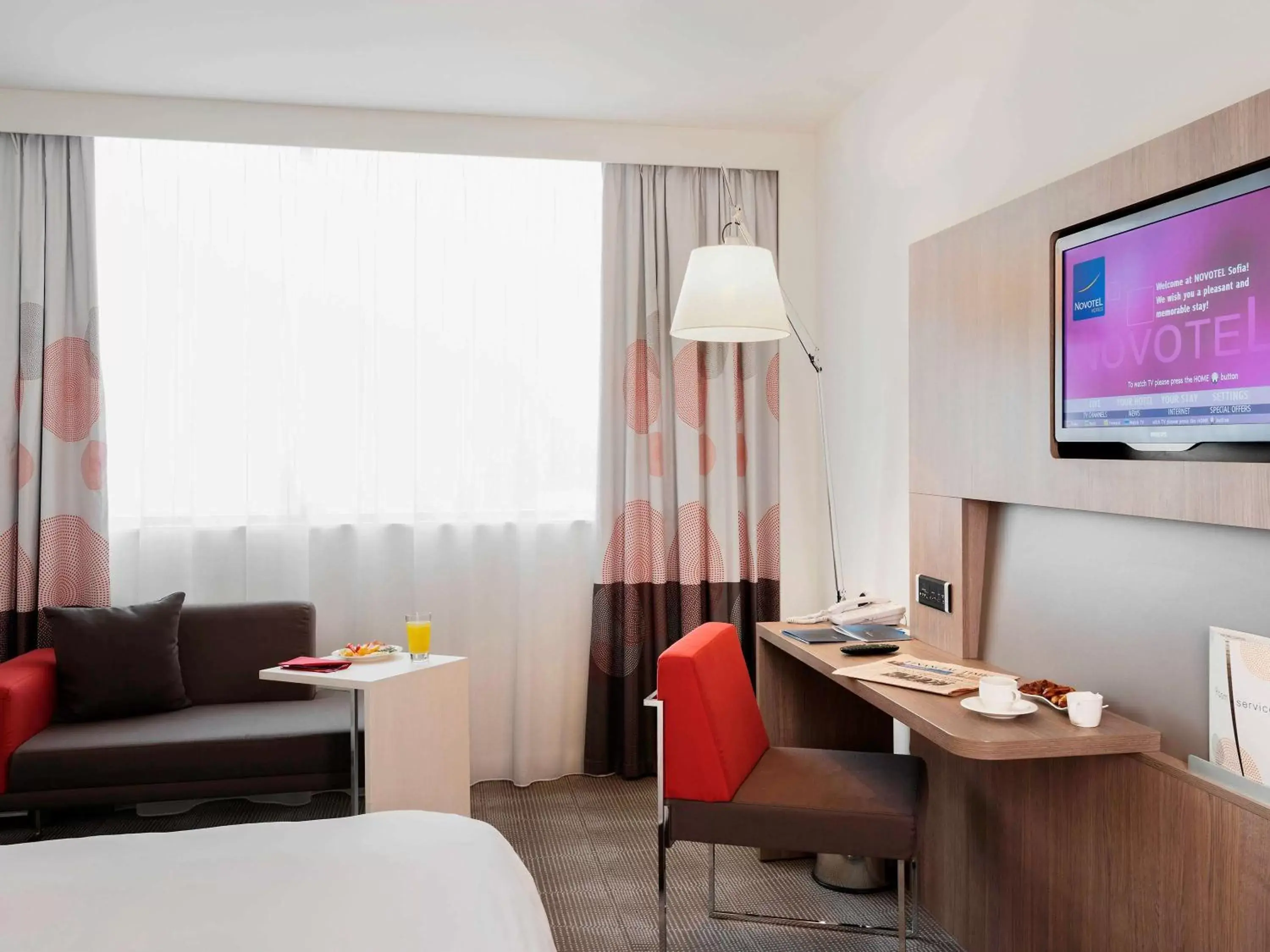 Photo of the whole room, TV/Entertainment Center in Novotel Sofia