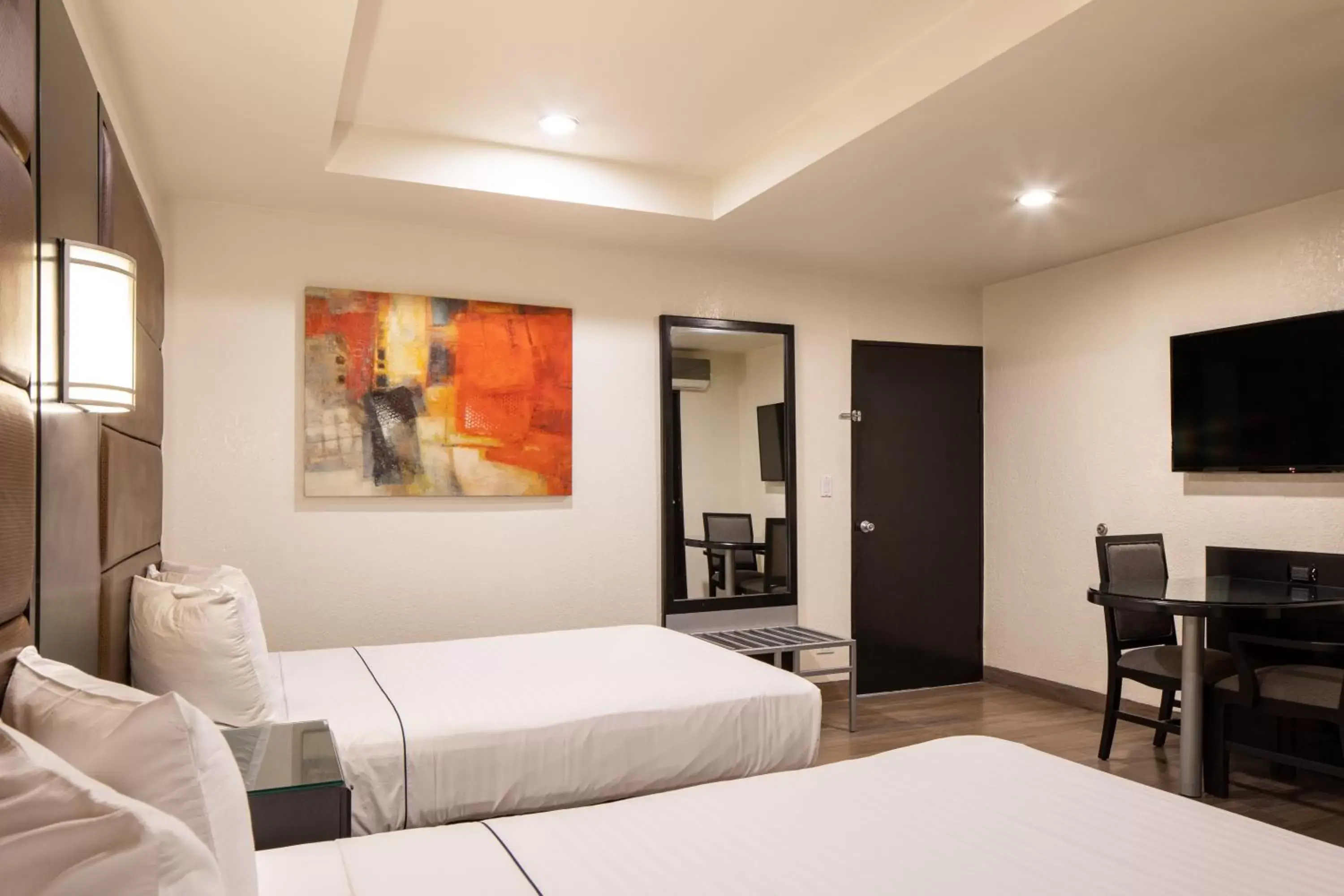 Communal lounge/ TV room, Bed in Hotel Astor Tijuana Communal lounge/ TV room, Bed in Hotel Astor Tijuana