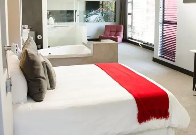 Bed in City Living Boutique Hotel