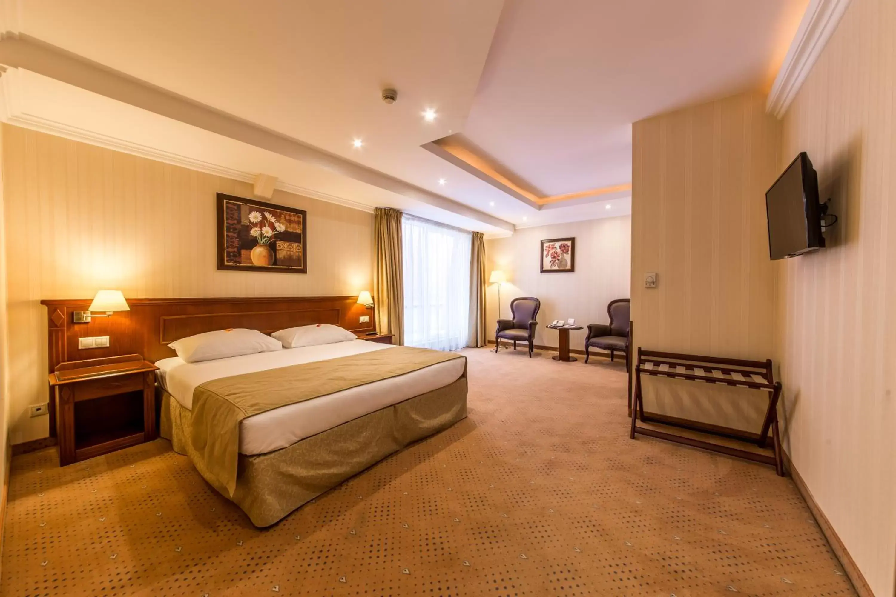 Bed in Ramada Hotel & Suites by Wyndham Bucharest North