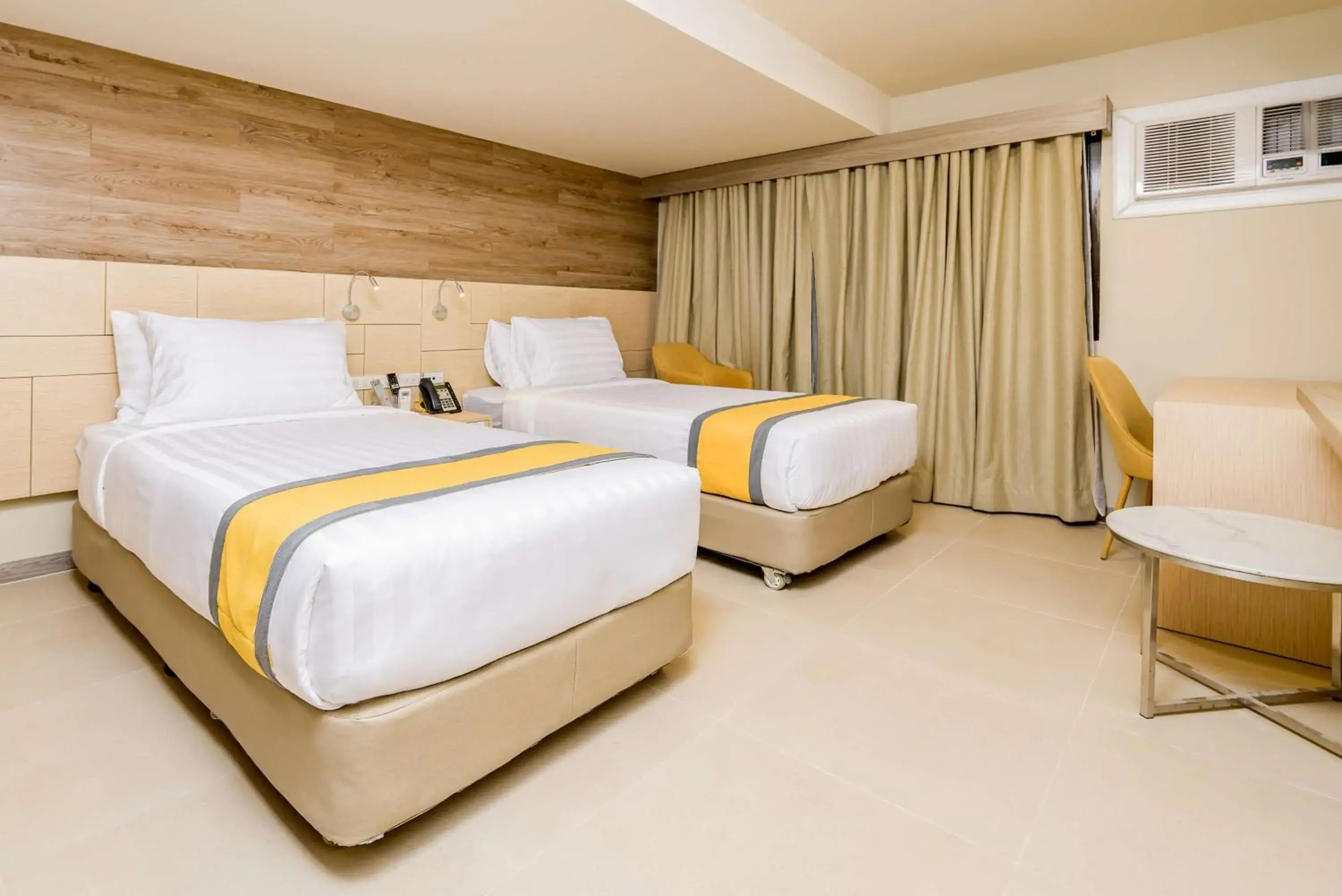 Bedroom, Bed in SureStay Plus by Best Western Cebu City