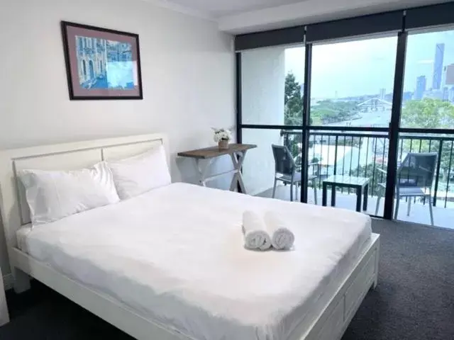 Bed in River Plaza Apartments